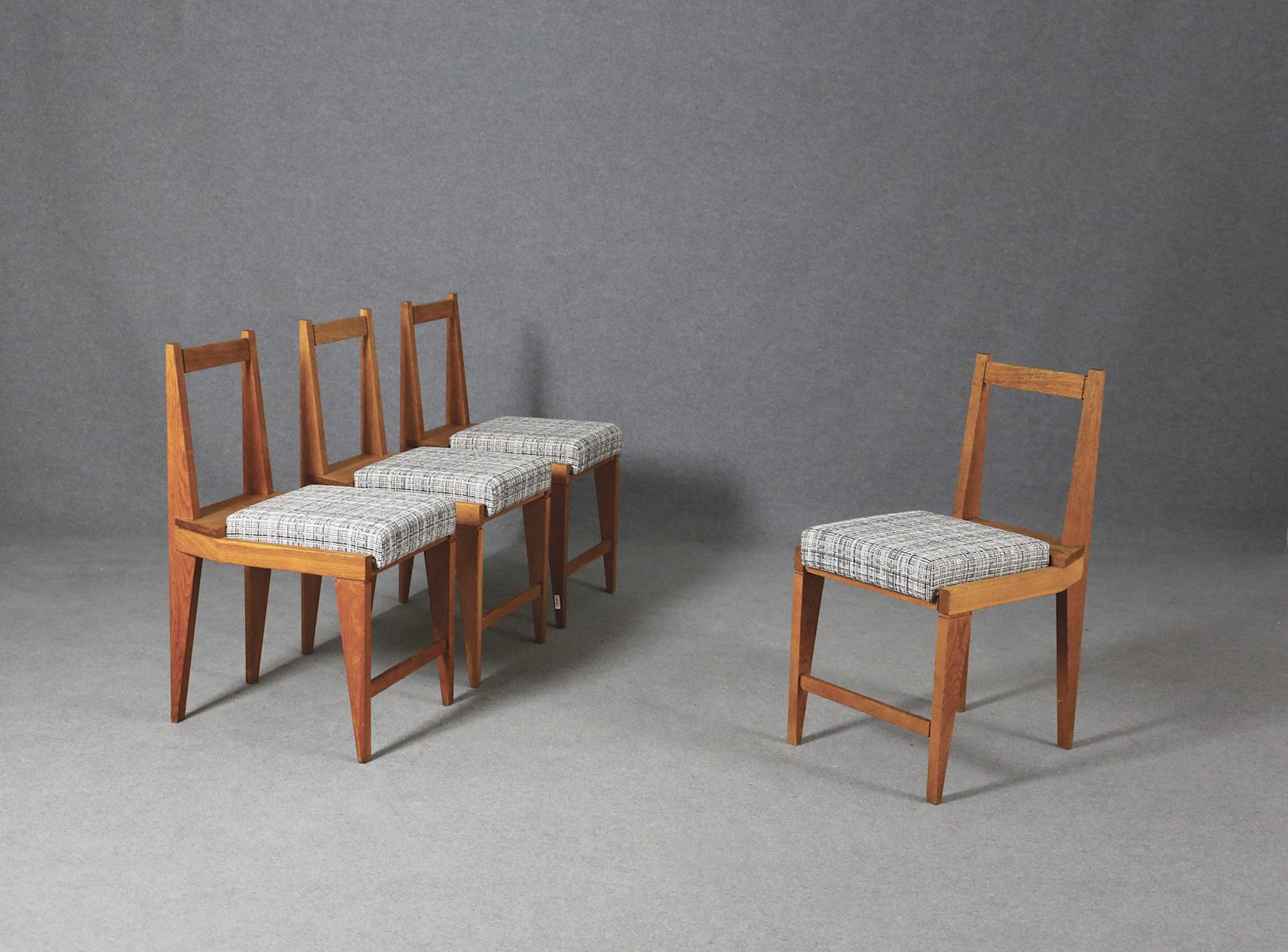 Set of four chairs by Augusto Romano years, 1950. The set of chairs is in perfect condition and are restored. The frame of each chair is in wood while the seat is in striped Italian cotton. The peculiarity of the chairs is its geometric play with