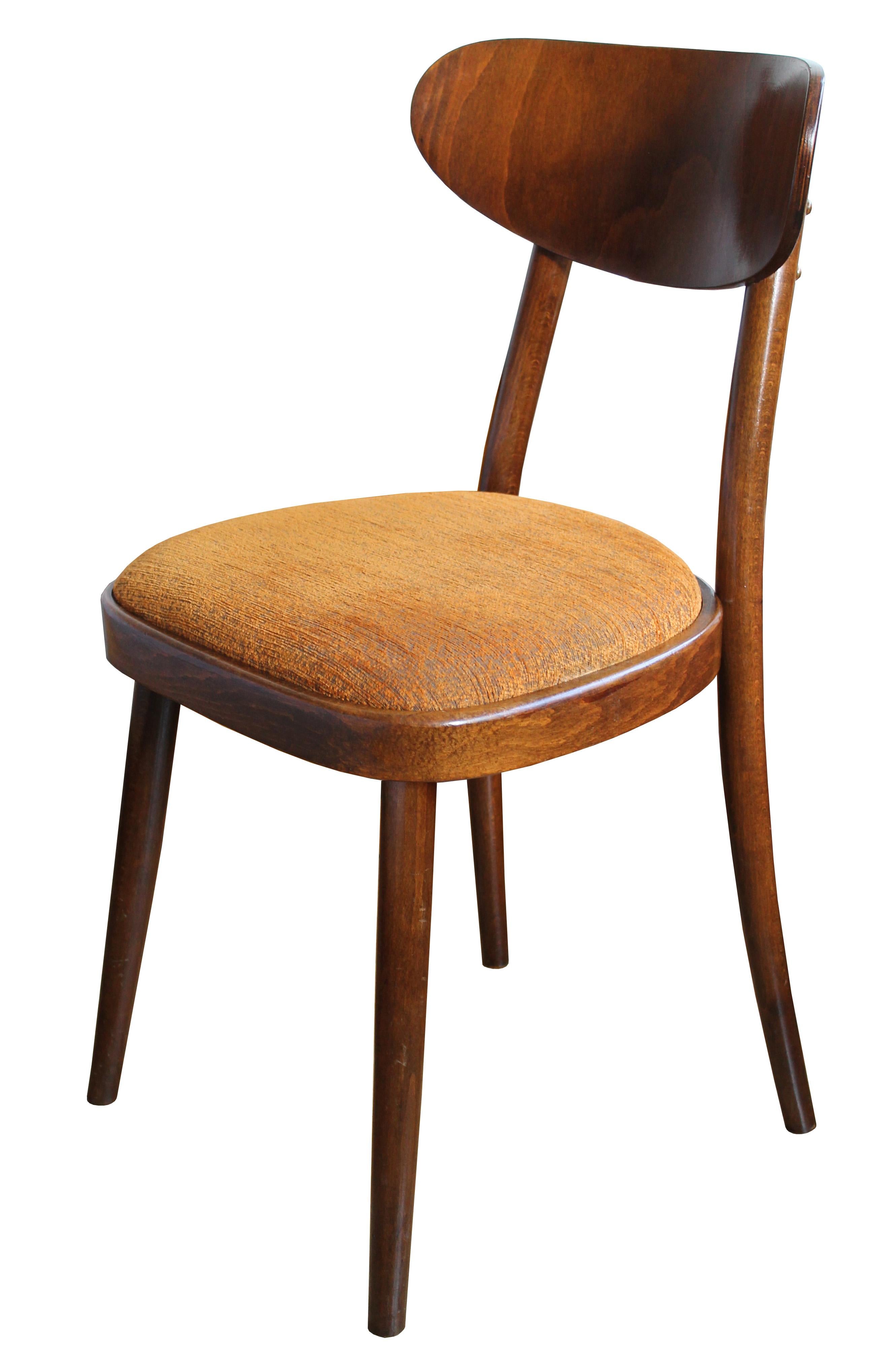 These simple and elegant dining chairs were designed and produced by TON Company in Czechoslovakia. The shape of these chairs is based on the traditional Thonet/TON dining chair. The bentwood backrest however is a typical design aesthetic of the