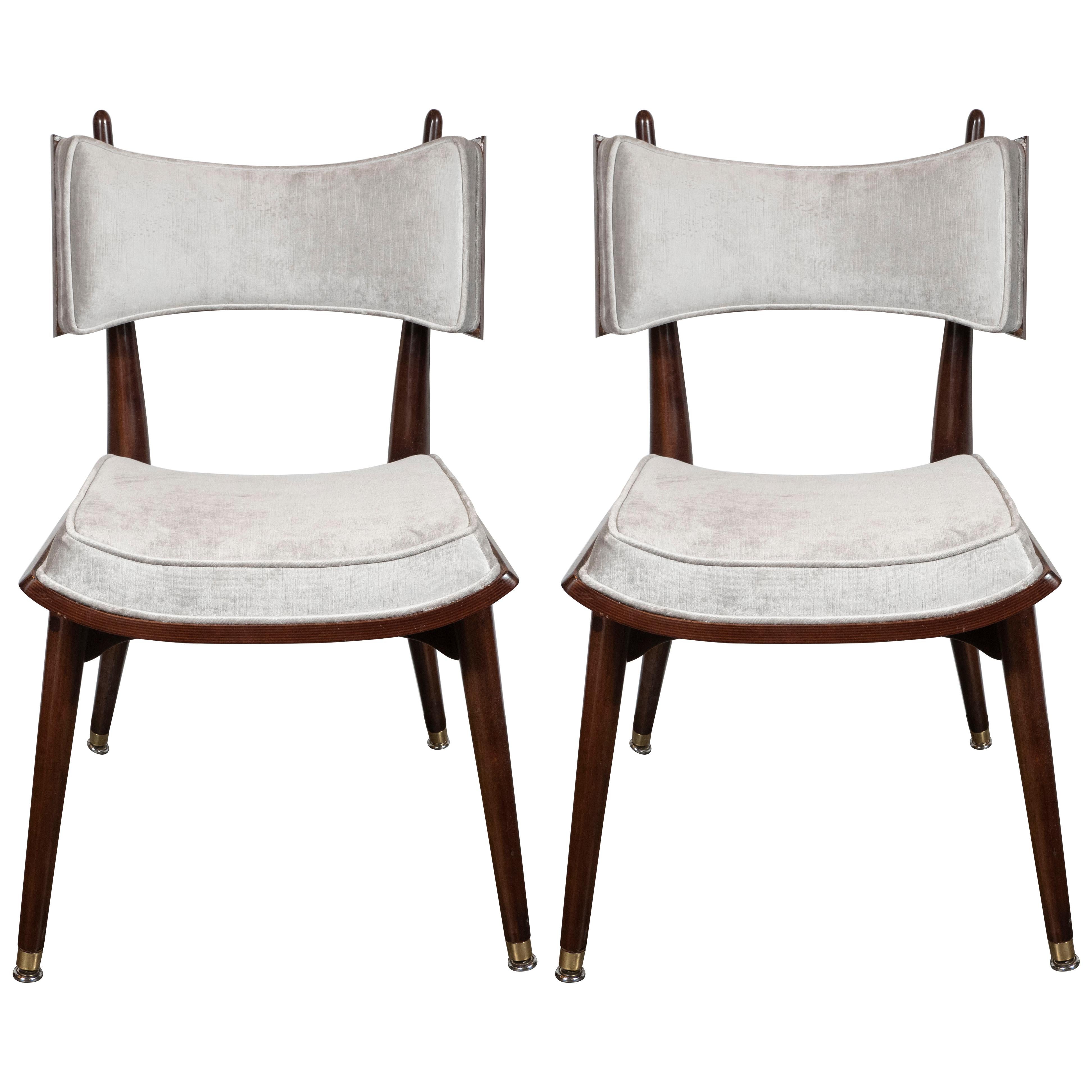 This rare and dramatic set of four game chairs were realized by the esteemed Mid-Century Modern Designer Harold Schwartz for the Romweber Furniture Co. in America, circa 1960. Handmade in handrubbed walnut with brass details throughout, two of the