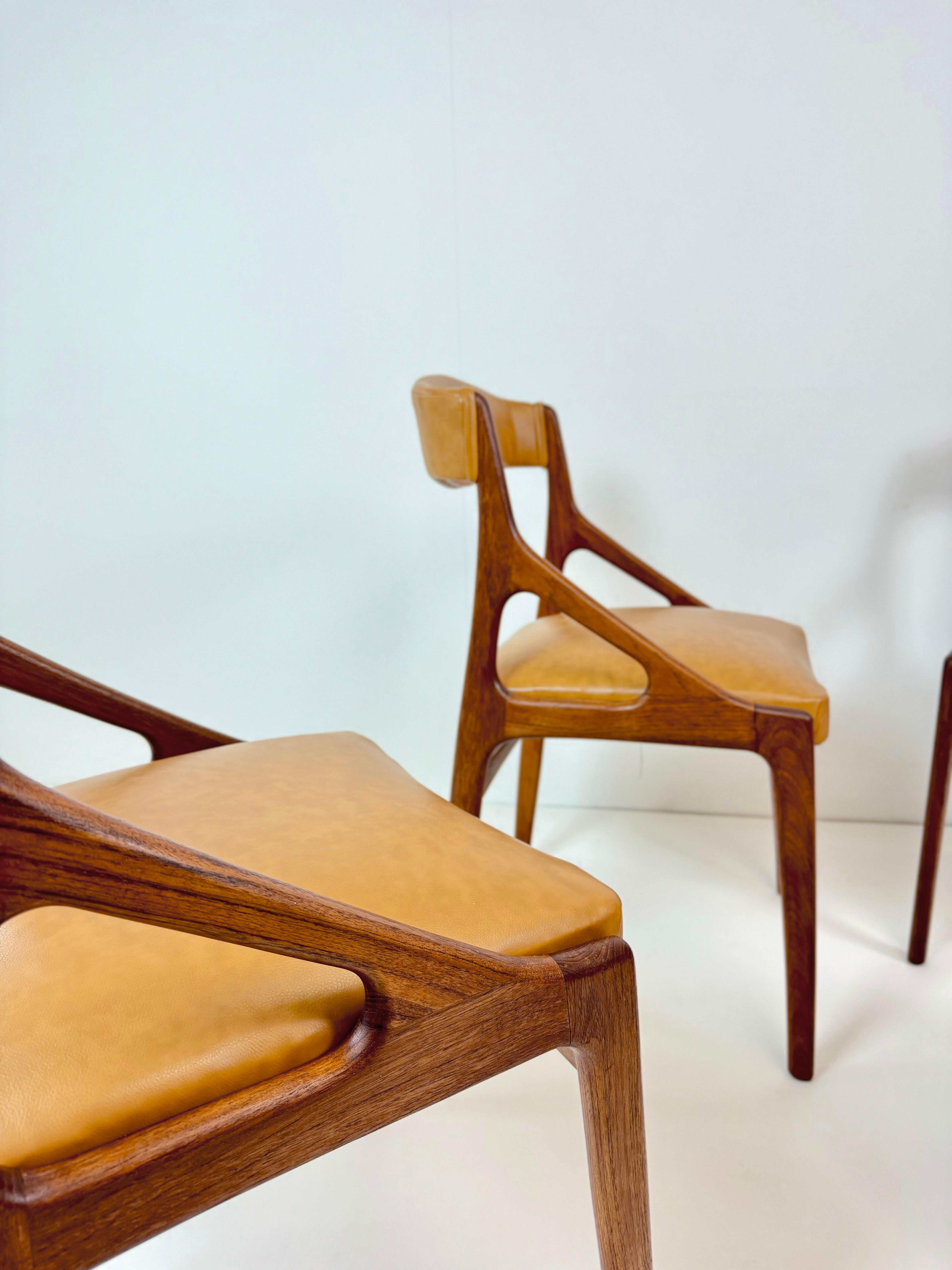 Faux Leather Set of Four Midcentury Modern Teak and Leatherette Dining Chairs c.1960's For Sale