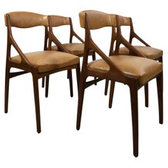 Satz von vier modernen Teakholz- und Kunstleder-Esszimmerstühlen aus der Mitte des Jahrhunderts, ca. 1960er Jahre