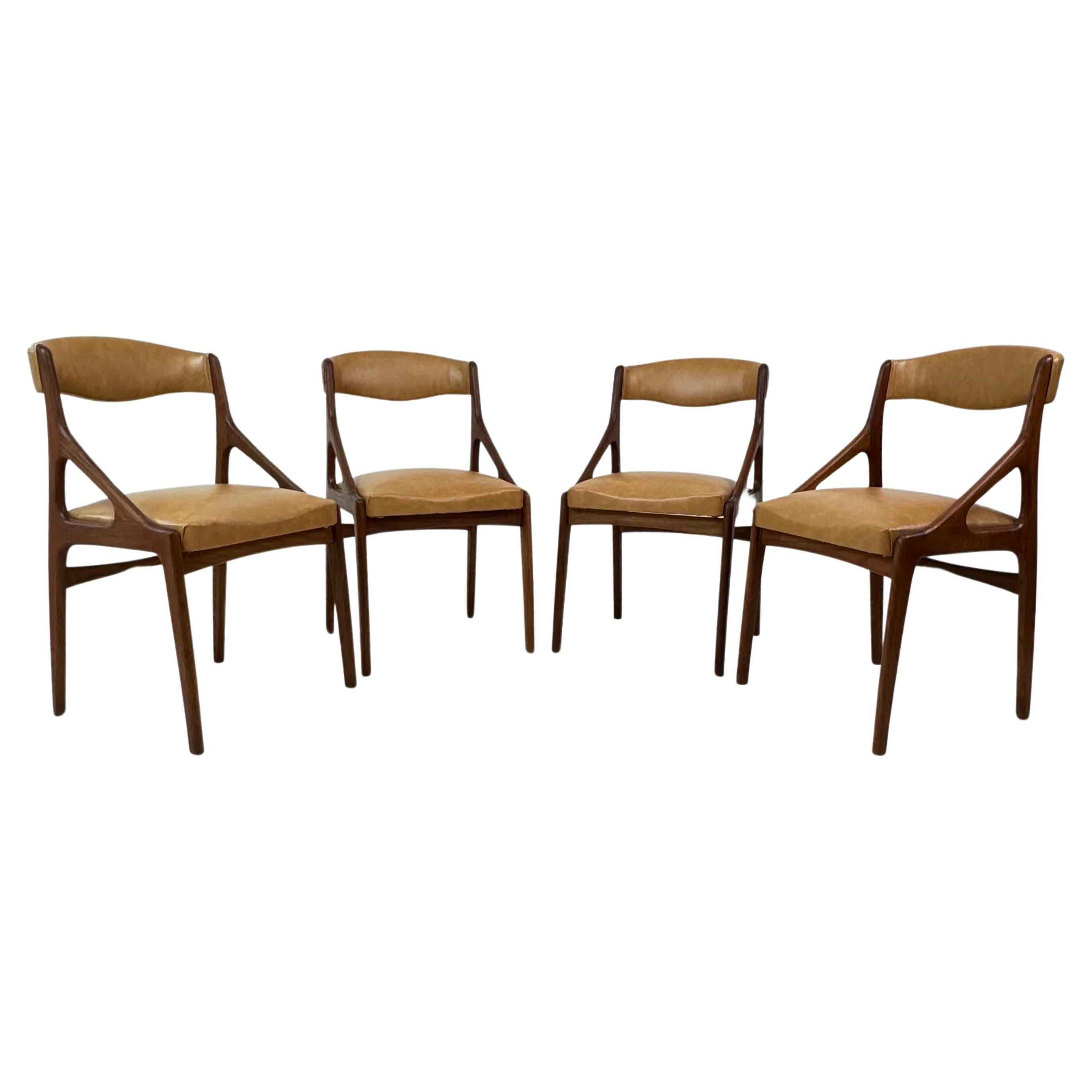Set of Four Midcentury Modern Teak and Leatherette Dining Chairs c.1960's For Sale
