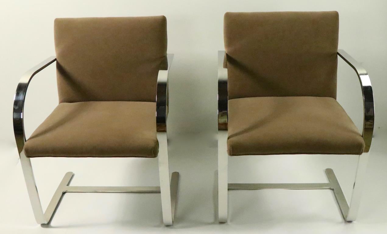 Excellent quality set of Brno chairs designed by Ludwig Mies van der Rohe and executed by Brueton. These chairs are in very good, original and clean condition. Upholstered in faux suede, with heavy solid stock flat bar polished steel frames.