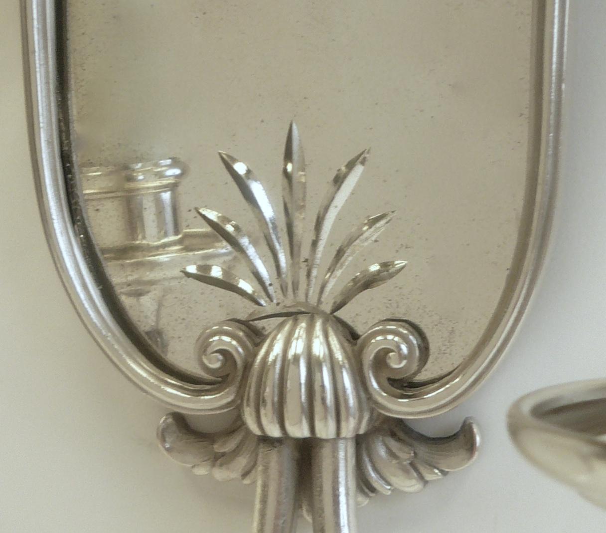 Silvered Set of Four Mirrored Back Silver Plated Two-Light Sconces by E. F. Caldwell