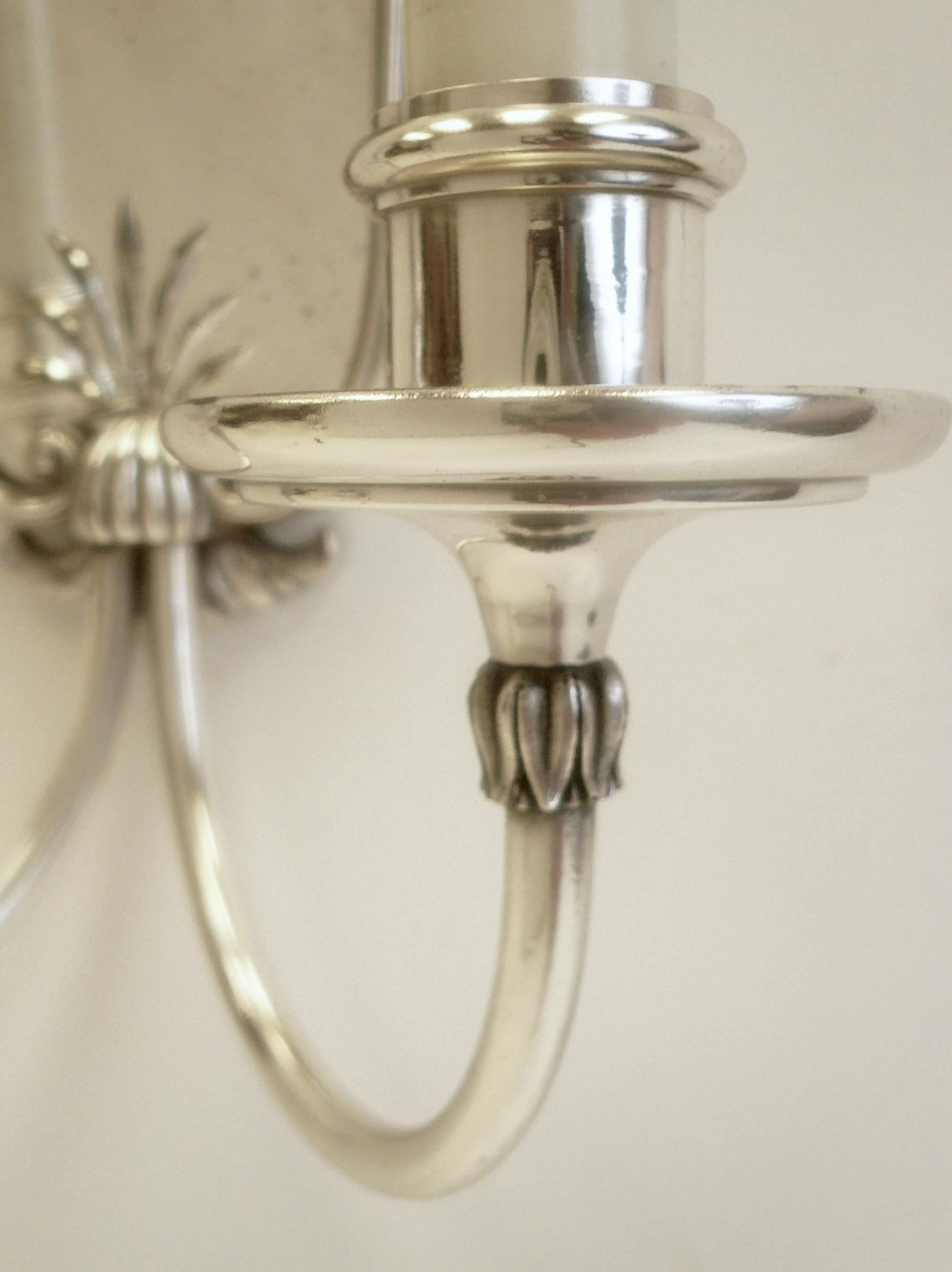 Set of Four Mirrored Back Silver Plated Two-Light Sconces by E. F. Caldwell In Good Condition In Pittsburgh, PA