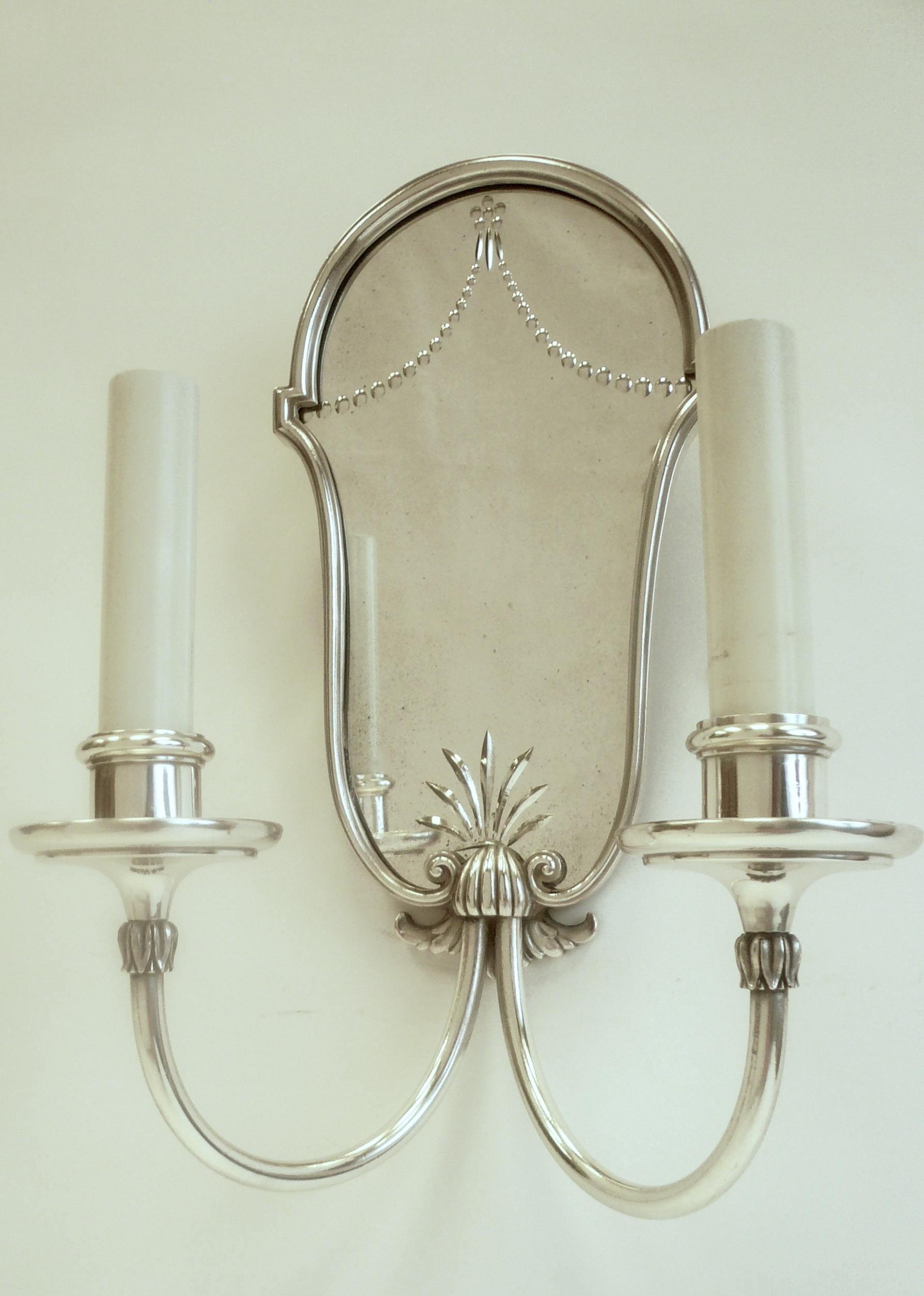 Set of Four Mirrored Back Silver Plated Two-Light Sconces by E. F. Caldwell 1