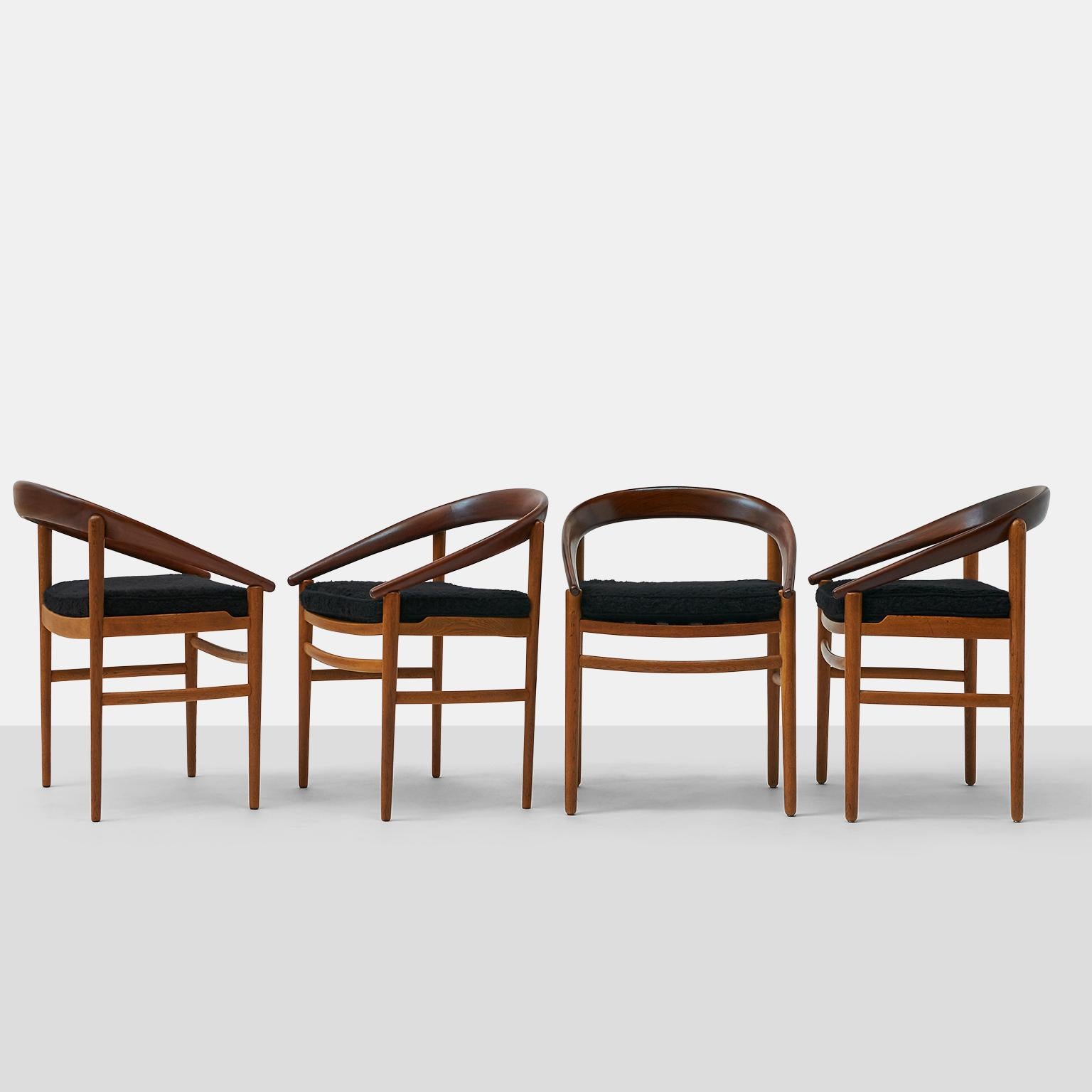 A set of 4 barrel back armchairs by Brockmann Petersen for Poul Jeppesen with two-toned, walnut continuous backs and ash frames. Chairs are marked Model 123 Denmark.

The frames have been lightly restored and new webbing on the seat. New seat