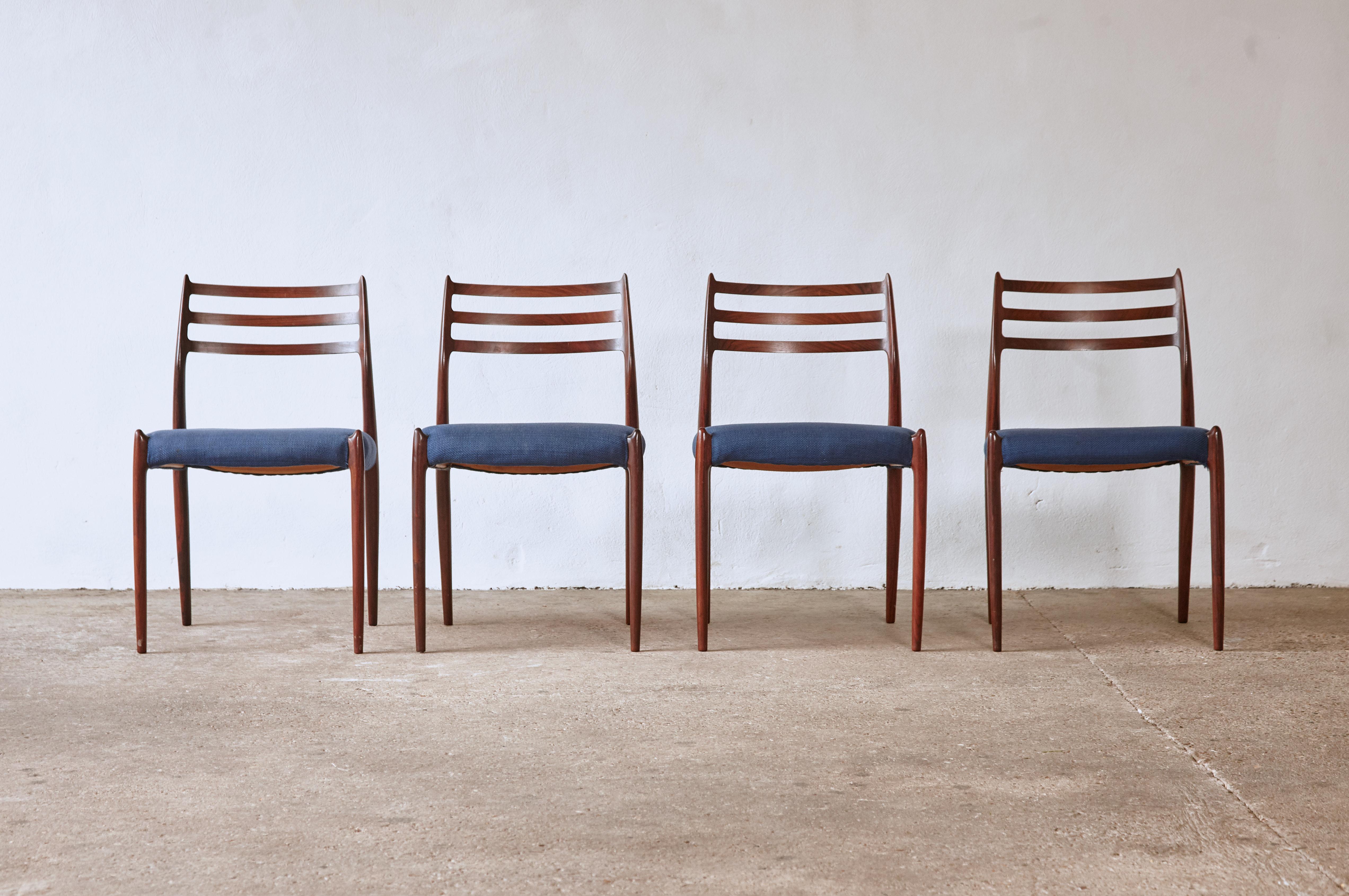 A lovely set of four rosewood N.O. Møller 78 side chairs with blue fabric seats, in good original condition, designed in 1962 for J.L. Møllers Møbelfabrik, Denmark. Ships worldwide.





 
 