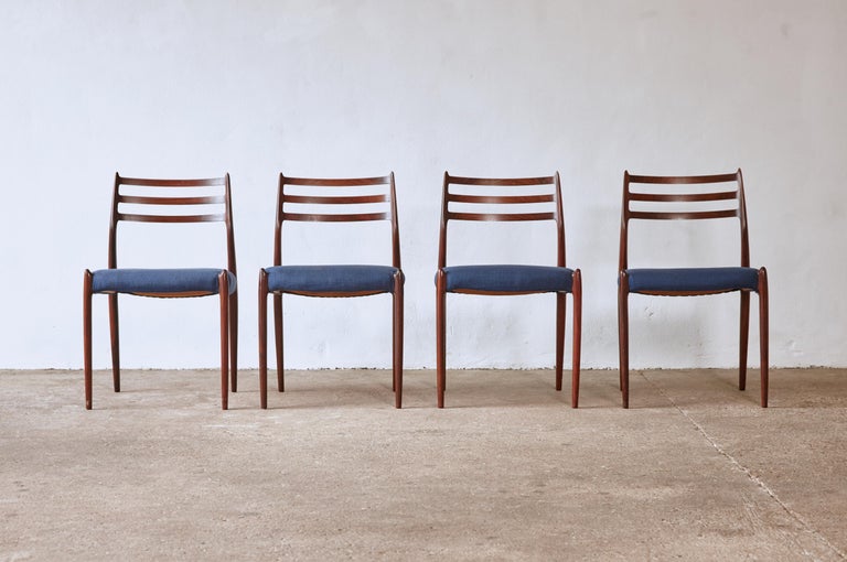 A lovely set of four rosewood N.O. Møller 78 side chairs with blue fabric seats, in good original condition, designed in 1962 for J.L. Møllers Møbelfabrik, Denmark. Ships worldwide.




UK customers please note: displayed prices do not include