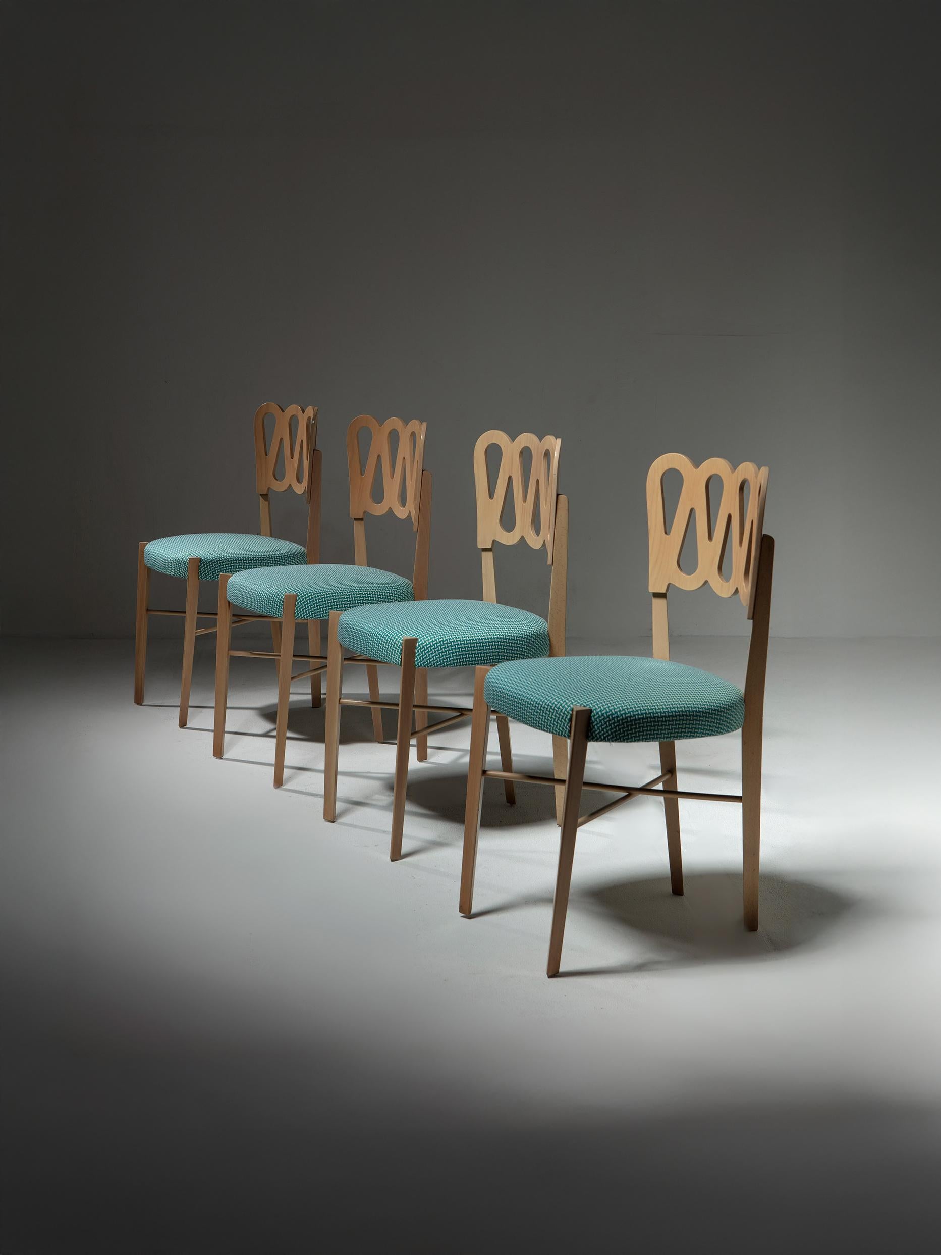 Set of four chairs by Gio Ponti for Montina.
Natural finish wood frames with scroll backrest.