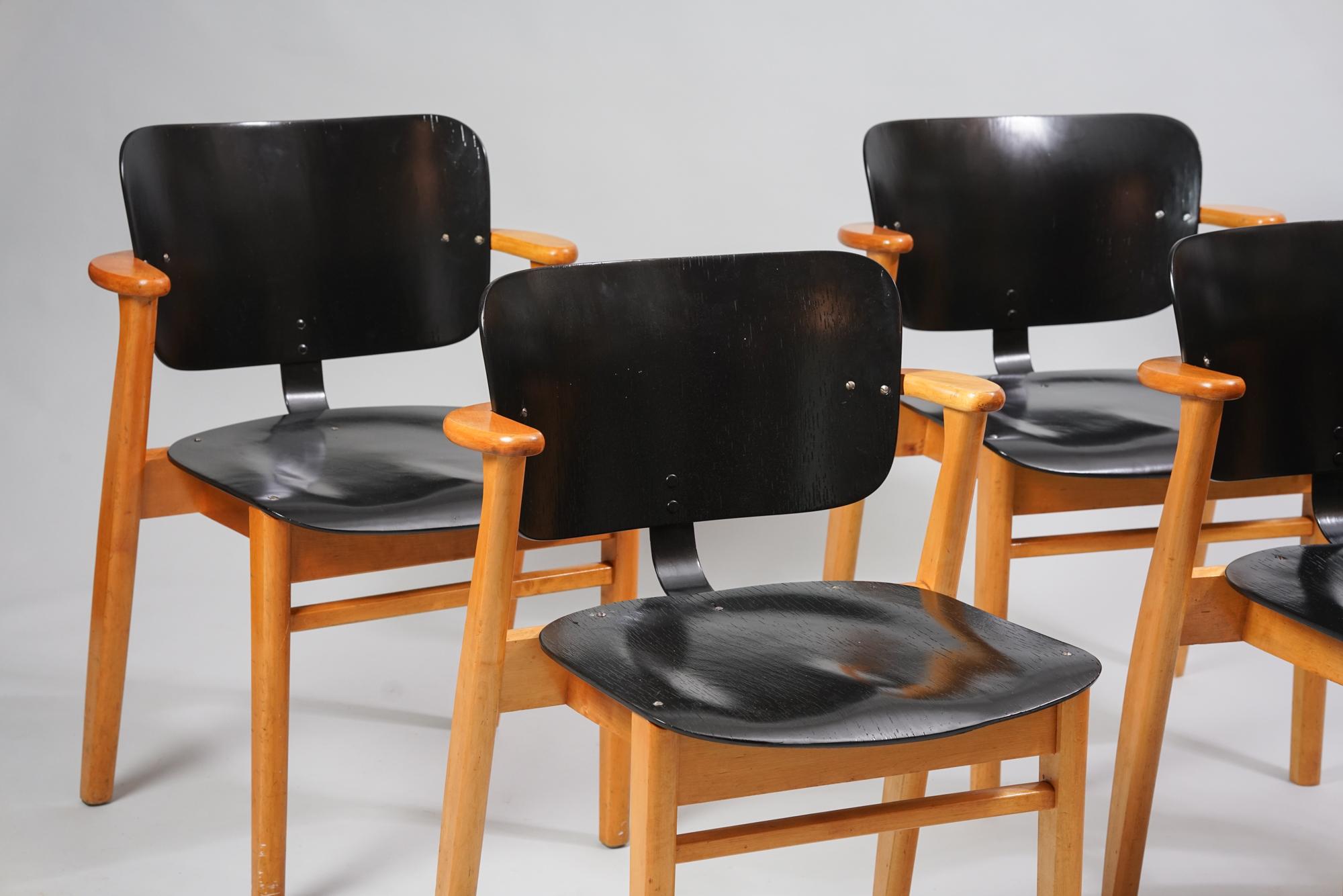 Set of four model Domus chairs by Ilmari Tapiovaara from the 1950s. Birch and birch plywood. The seats have been repainted. Good vintage condition, minor patina and wear consistent with age and use. The chairs are sold as a set. Classic Ilmari