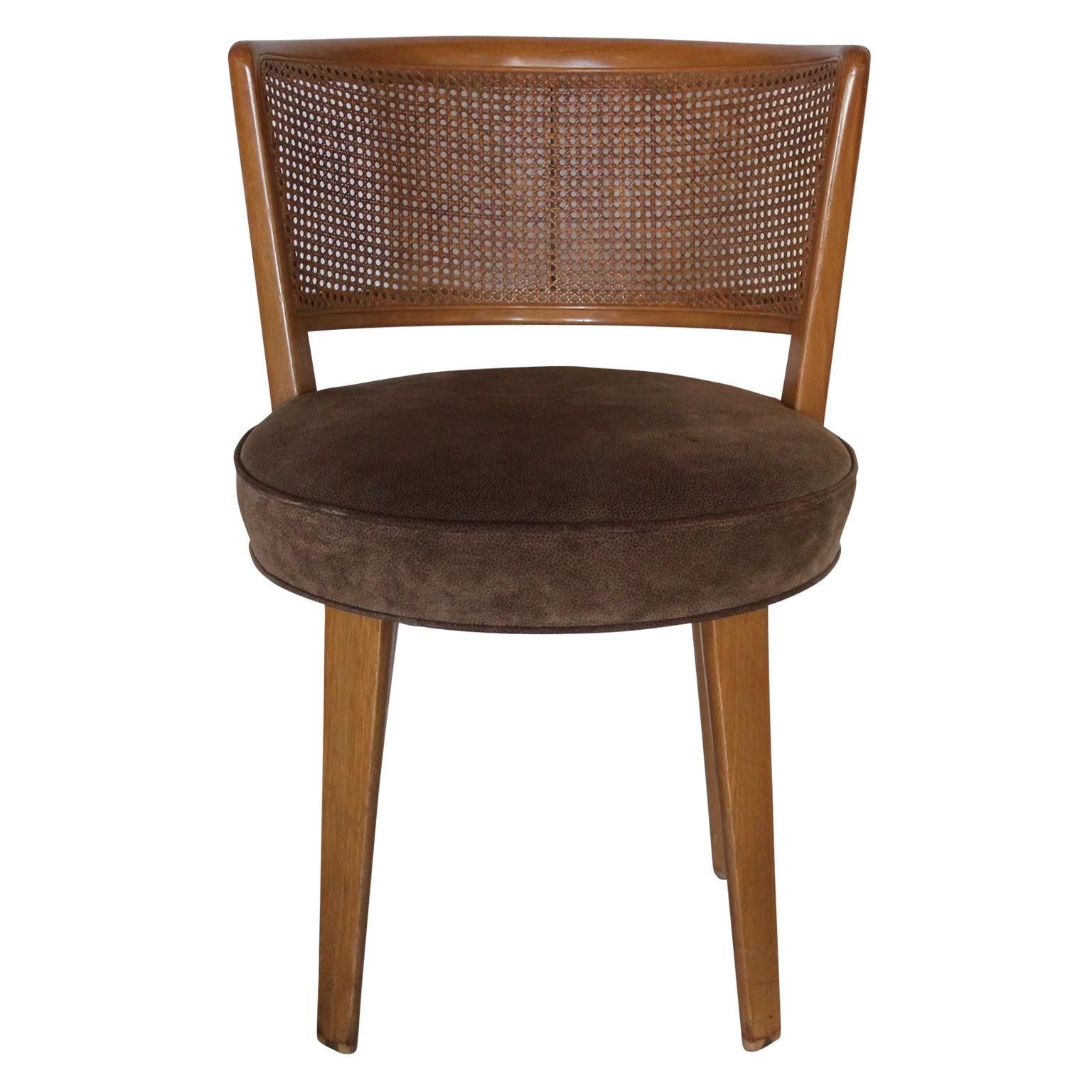 Set of four Mid-Century Modern cane back swivel dining chairs designed by Edward Wormley for Dunbar.
 