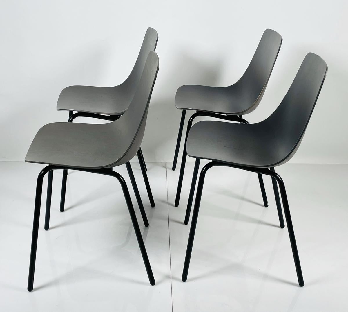 Set of Four Modern Chairs with Molded Seats and Black Metal Frames In Fair Condition For Sale In Los Angeles, CA