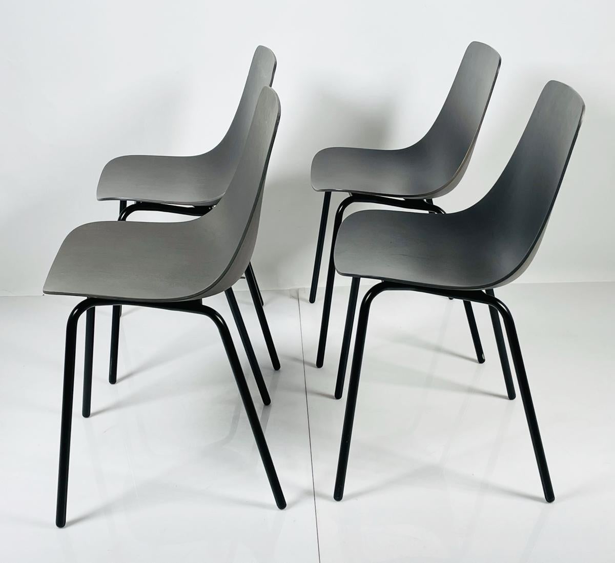 Contemporary Set of Four Modern Chairs with Molded Seats and Black Metal Frames For Sale