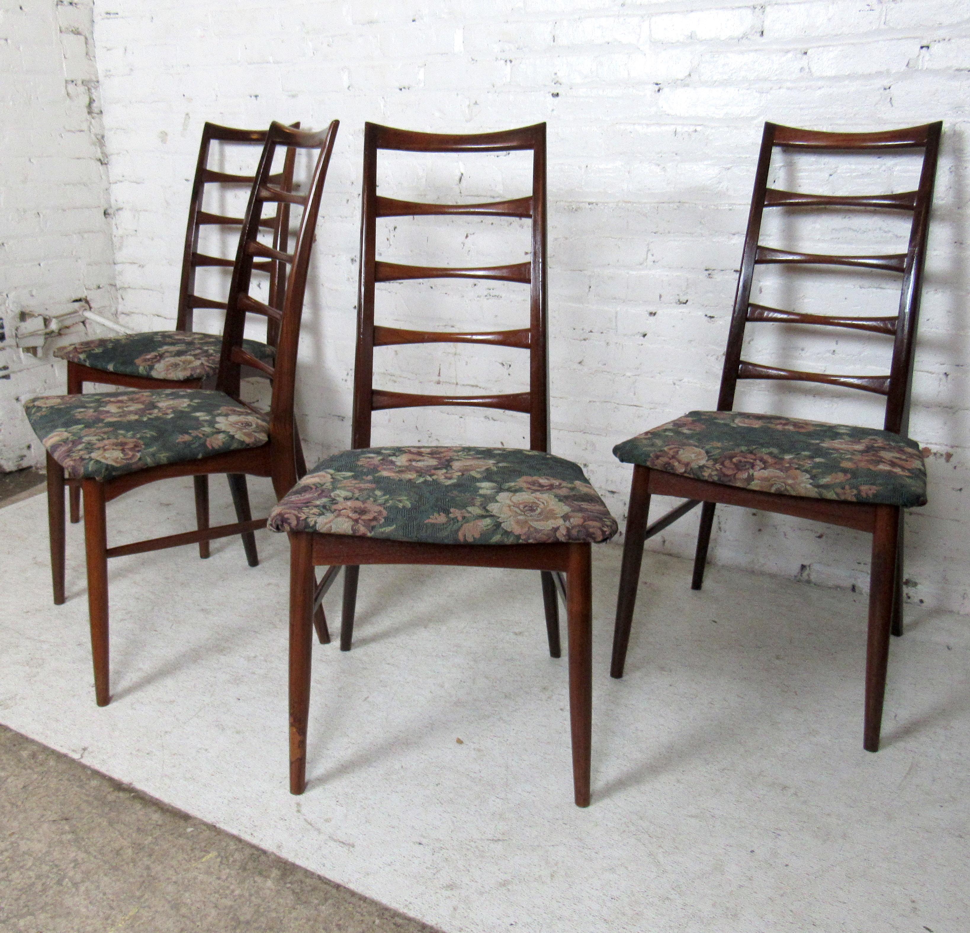 Mid-Century Modern set of four dining chairs by Niels Koefoed featuring a high slatted ladder back and floral reupholstery.

(Please confirm item location - NY or NJ - with dealer).