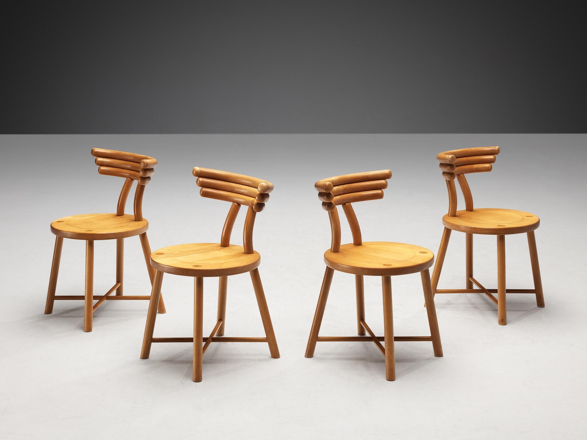 Set of four dining chairs, beech, Germany, 1970s. 

Great visually interesting set of dining chairs made in Germany in the 1970s. This design shows an interesting construction of the backrest, which is composed of stacked round slats that give these