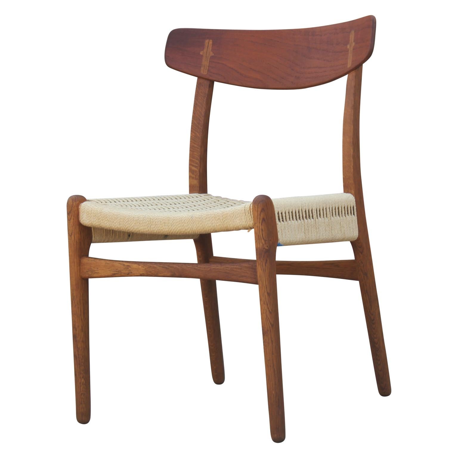 Scandinavian Modern Set of Four Modern Hans Wegner Teak and Woven Cord Dining Chairs Model CH23