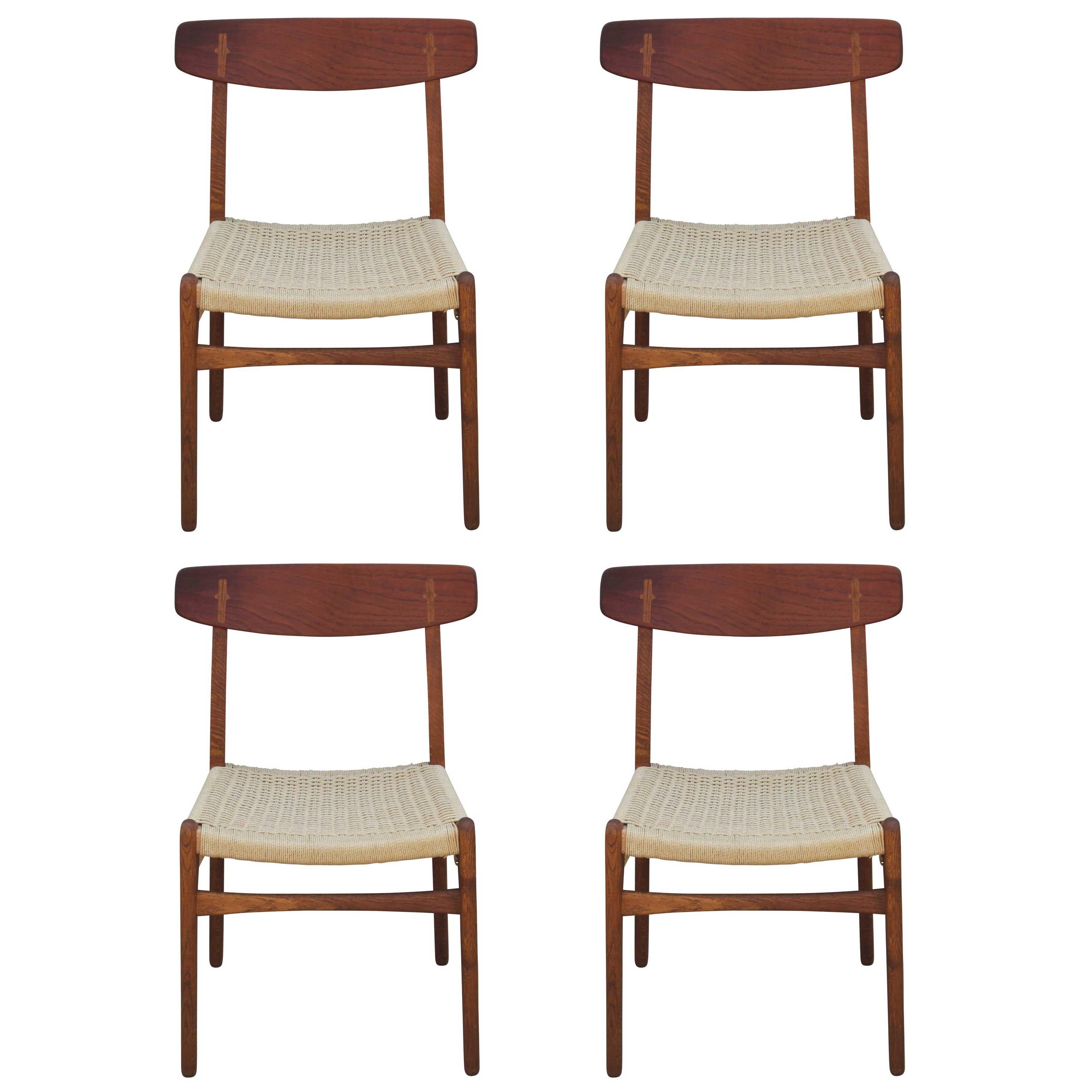 Set of Four Modern Hans Wegner Teak and Woven Cord Dining Chairs Model CH23