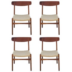 Set of Four Modern Hans Wegner Teak and Woven Cord Dining Chairs Model CH23