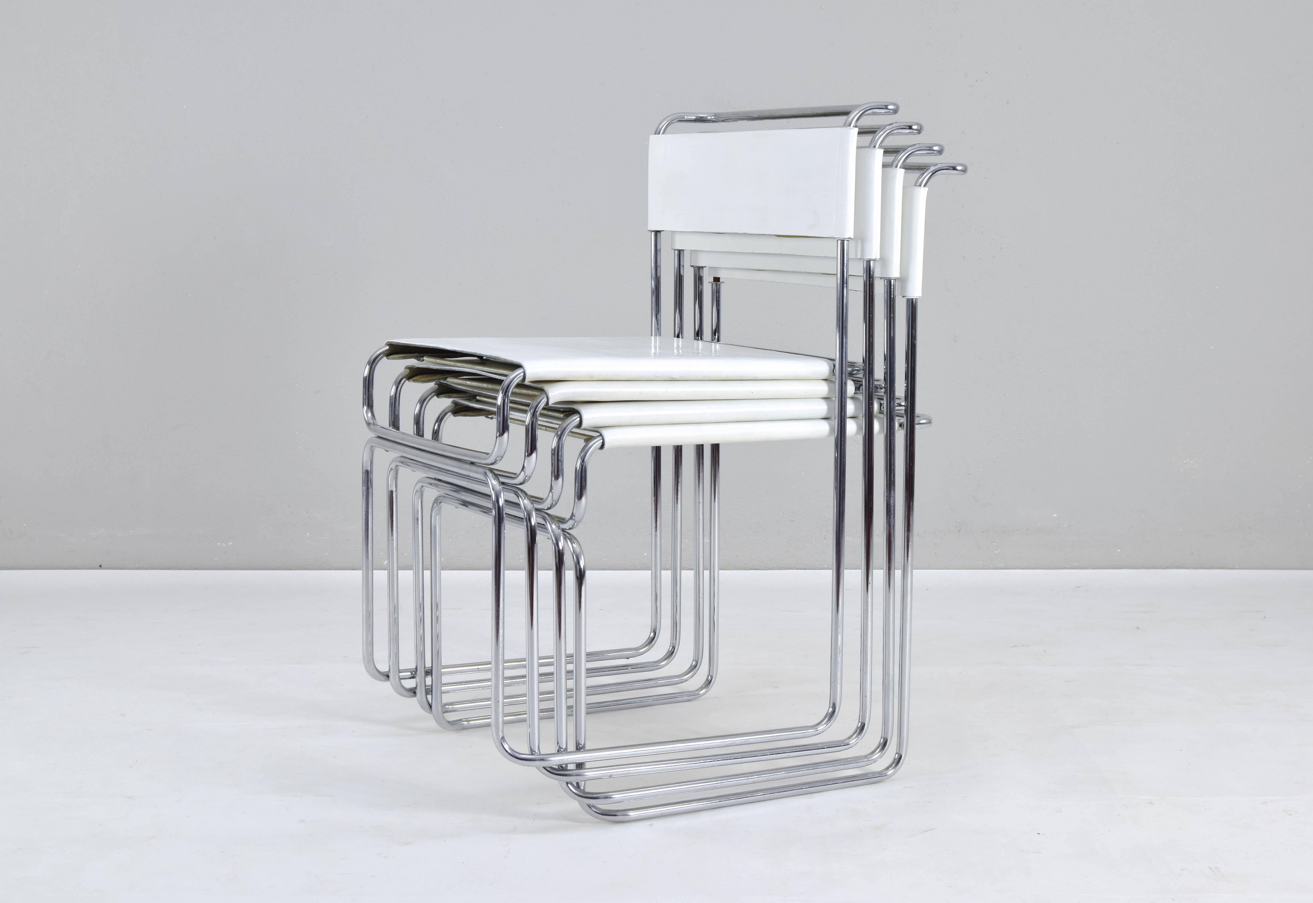 Set of four Libellula Stackable Dining Chairs by Giovanni Carini for Planula, Italy 1970s.
Chromed steel structure and white leather upholstery attached to the structure by a system of exposed springs.
Spectacular design and very good original