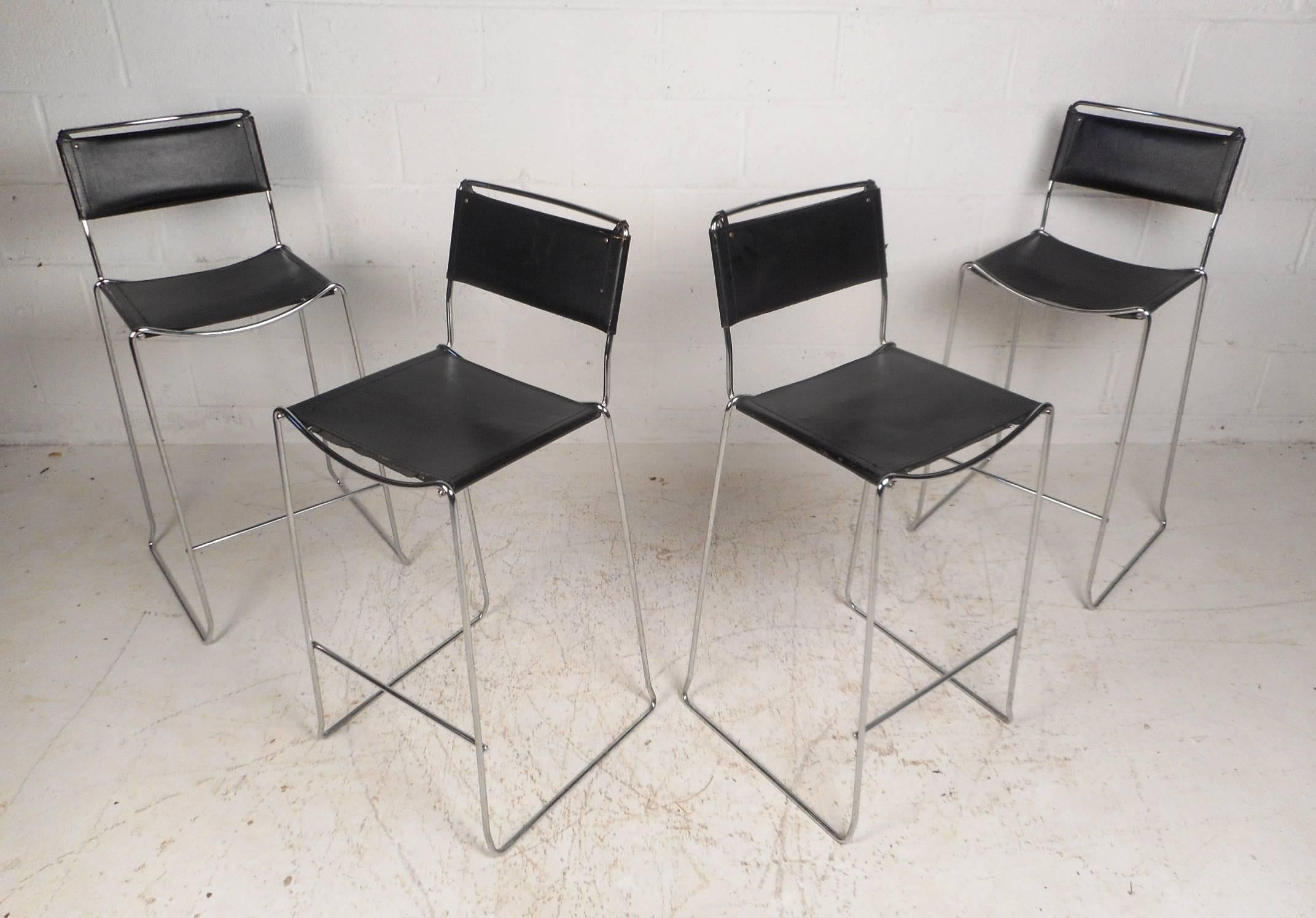 This stunning set of four vintage modern bar stools feature chrome rod frames and sled legs. A sleek design with leather seats and back rests ensuring maximum comfort. These comfortable and stylish stools make the perfect addition to any seating