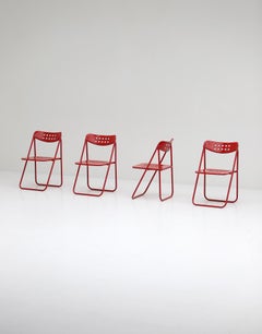 Set of Four Modern Red Lacquered Metal Folding Chairs 1980s