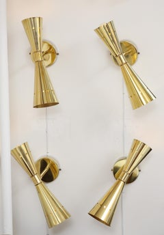 Set of Four Modernist Brass Double Cone Wall Lights or Sconces, Italy
