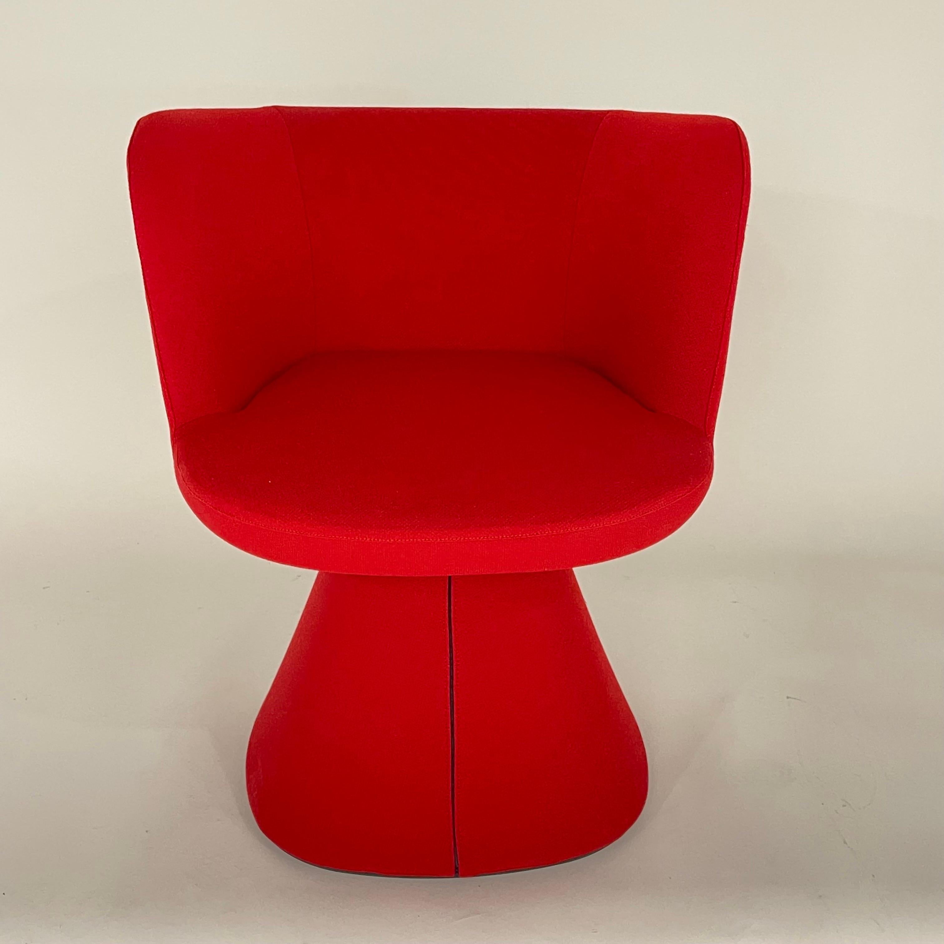Modern set of four Flair O' rotating swivel dining chairs rendered in a luxurious red fabric with an auto return swivel mechanism perfect for dining room chairs game chairs or side chairs.  Designed by Monica Armani for B & B Italia, Italy 2022