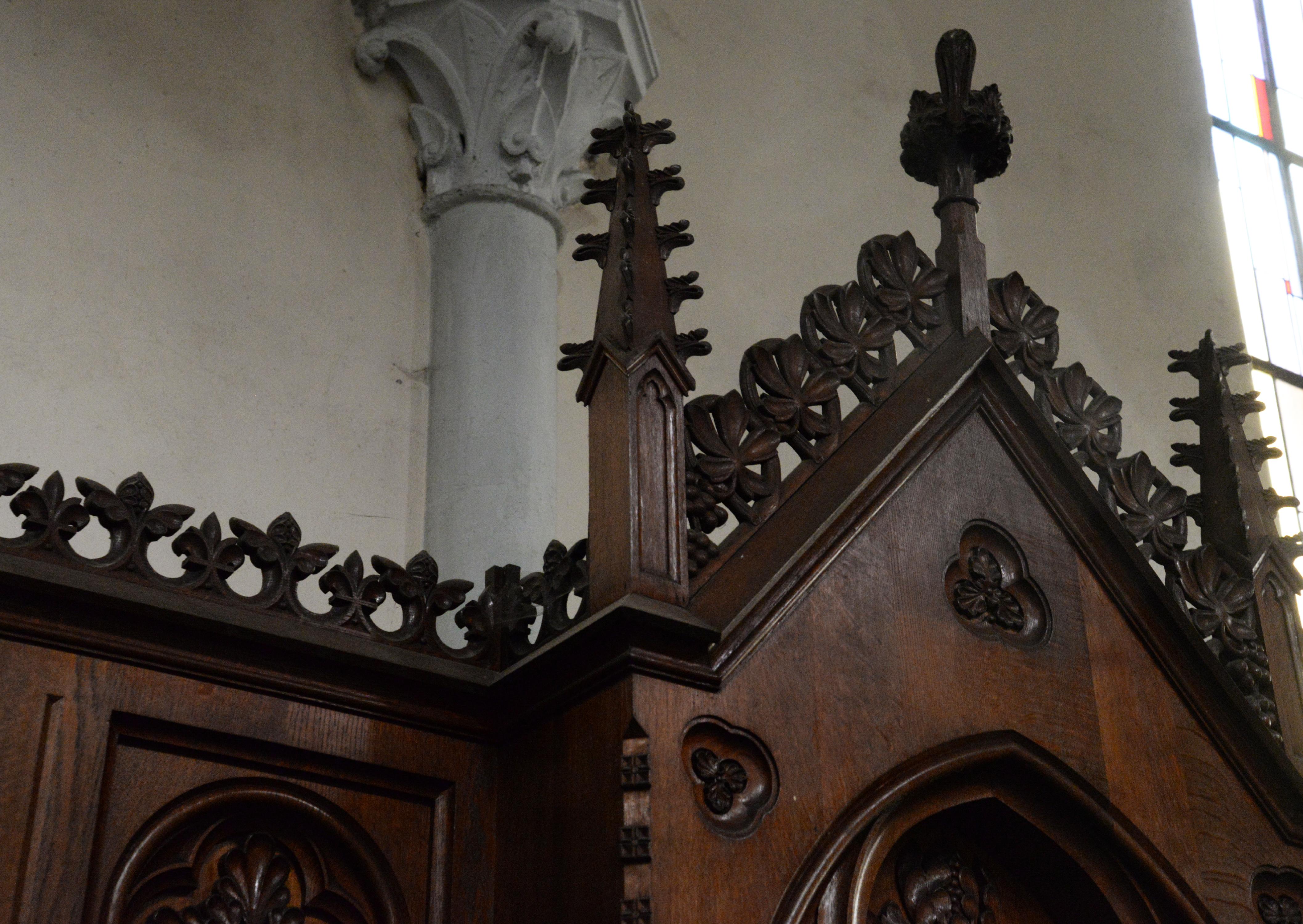 A group of four antique confessionals in Neo-Gothic style, made of oak.