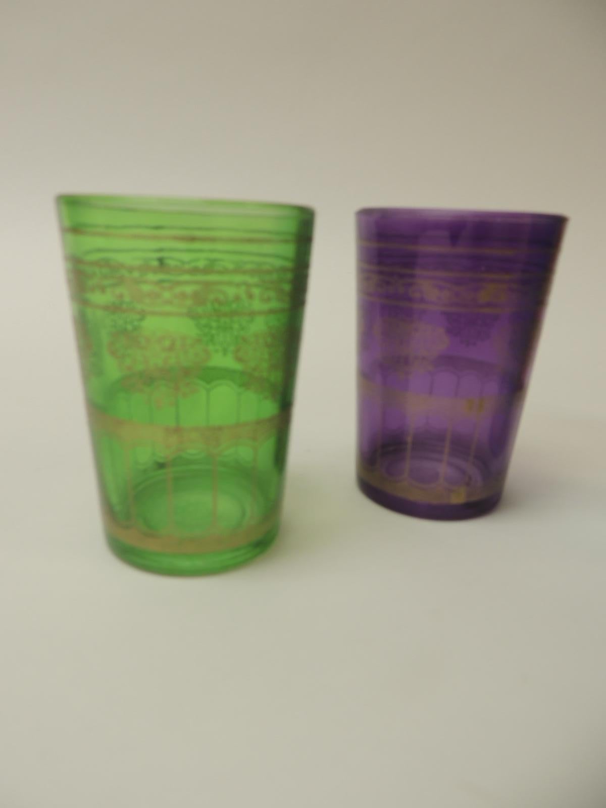 Set of Four Moroccan colorful tea glasses
In shades of gold, purple, turquoise and green with Moorish gold Motif.
Size: 2. ¼ D x 3 ¼ H.
      
