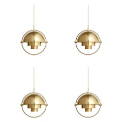 Ensemble de quatre pendentifs multi-lumières, laiton