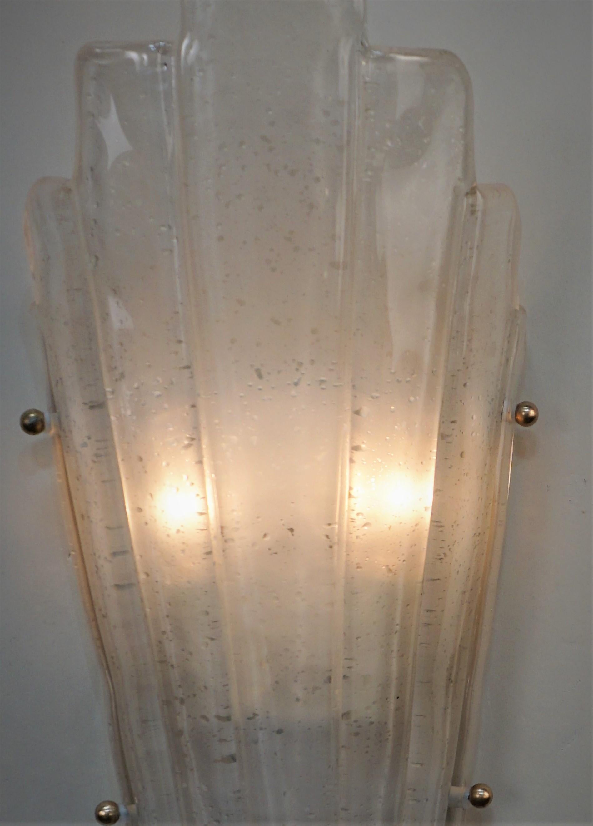 Set of four blown clear frost with texture Murano glass wall sconces with double light in each.
Two pairs are available, price is for one pair.
 
