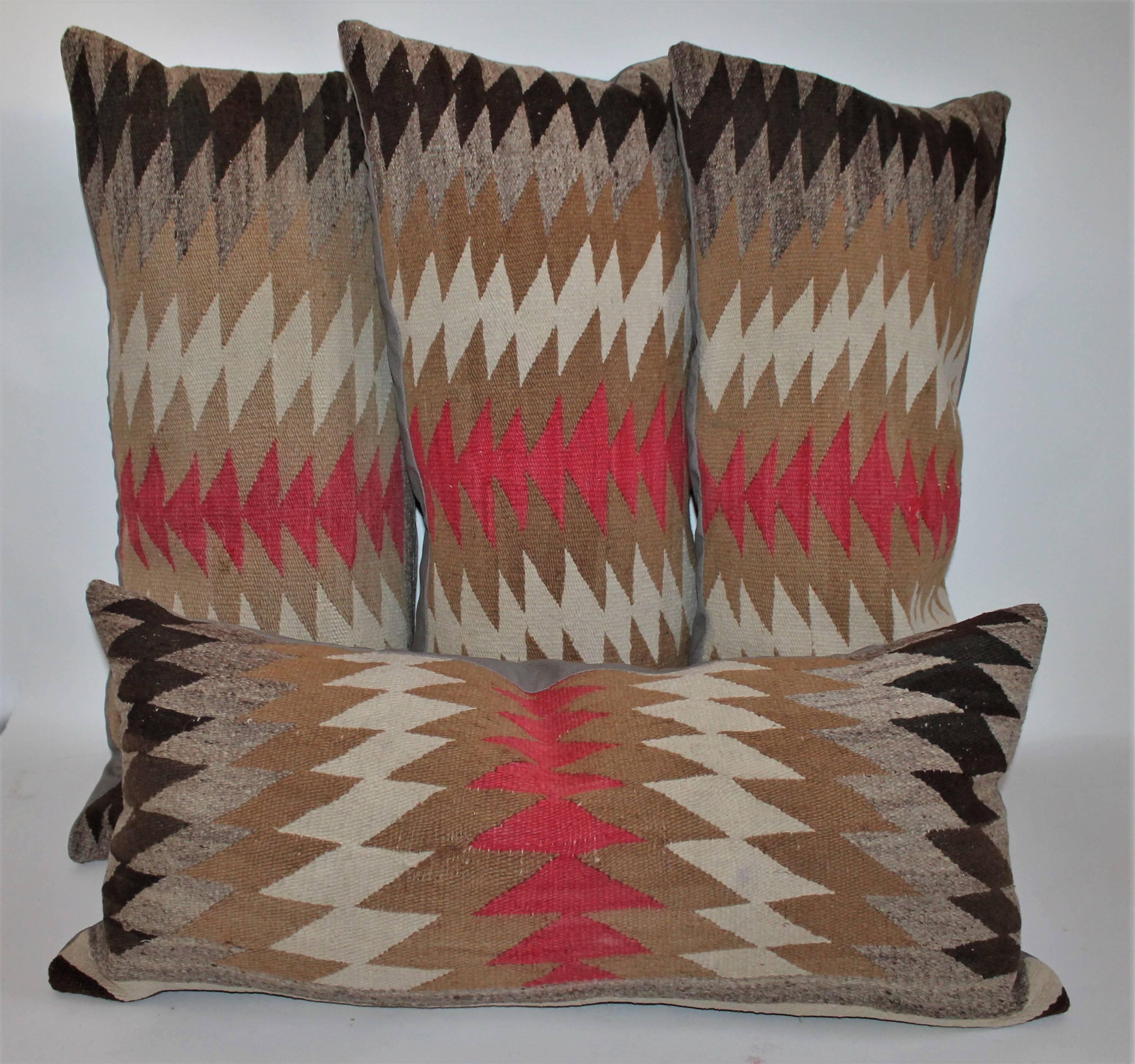 All pillows measure 32 inches wide by 13 inches in height the Navajo weaving's pillows are all in good condition. The backing is in tan cotton linen.
These pillows have a depth of about 5 inches each.