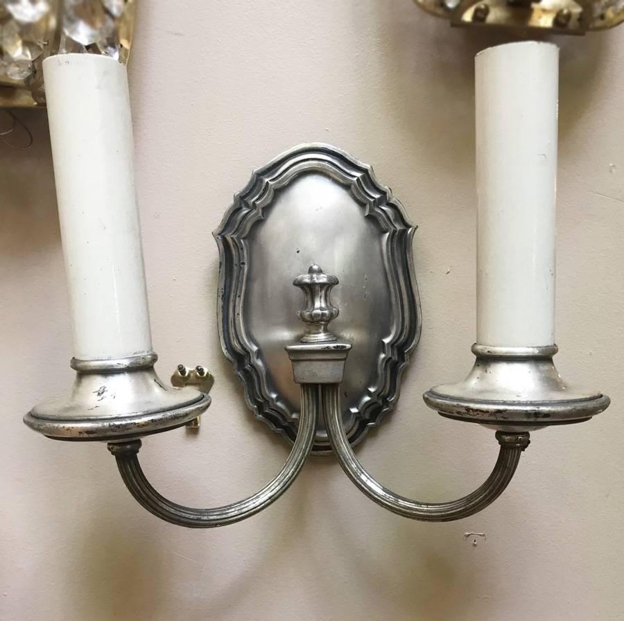Set of four silver plated neoclassic sconces with original finish and patina in a neoclassic style.
Measures: 9