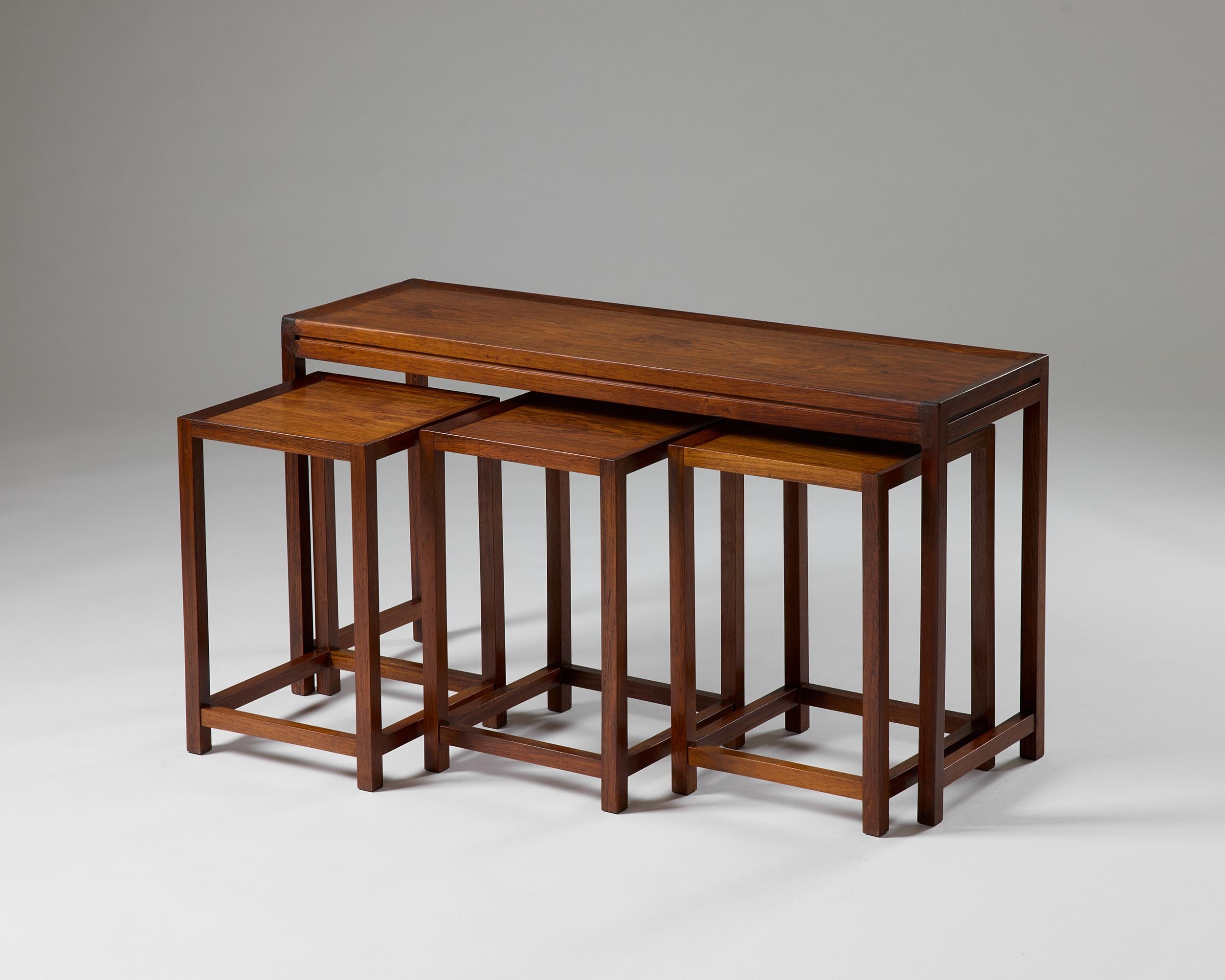 Set of four nesting tables designed by Aksel Kjersgaard, Denmark, 1960s

Brazilian rosewood.

Main Table:
H: 53 cm / 20 7/8