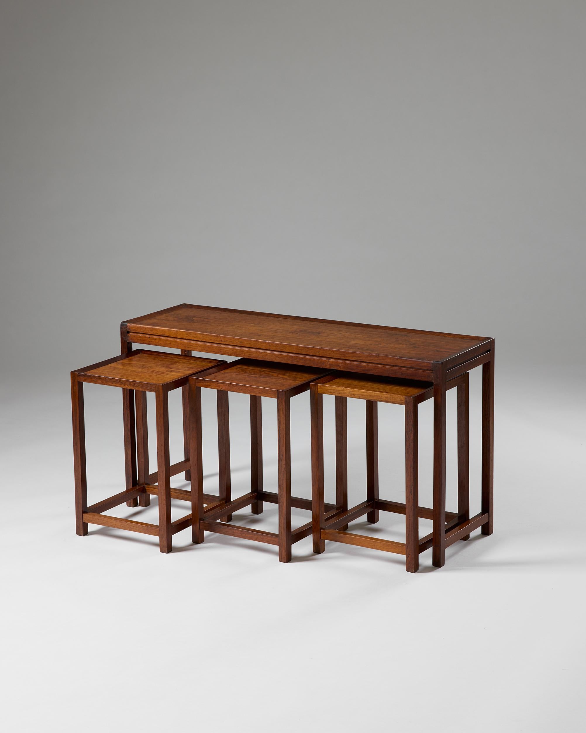 Danish Set of four nesting tables designed by Aksel Kjersgaard, Denmark, 1960s For Sale