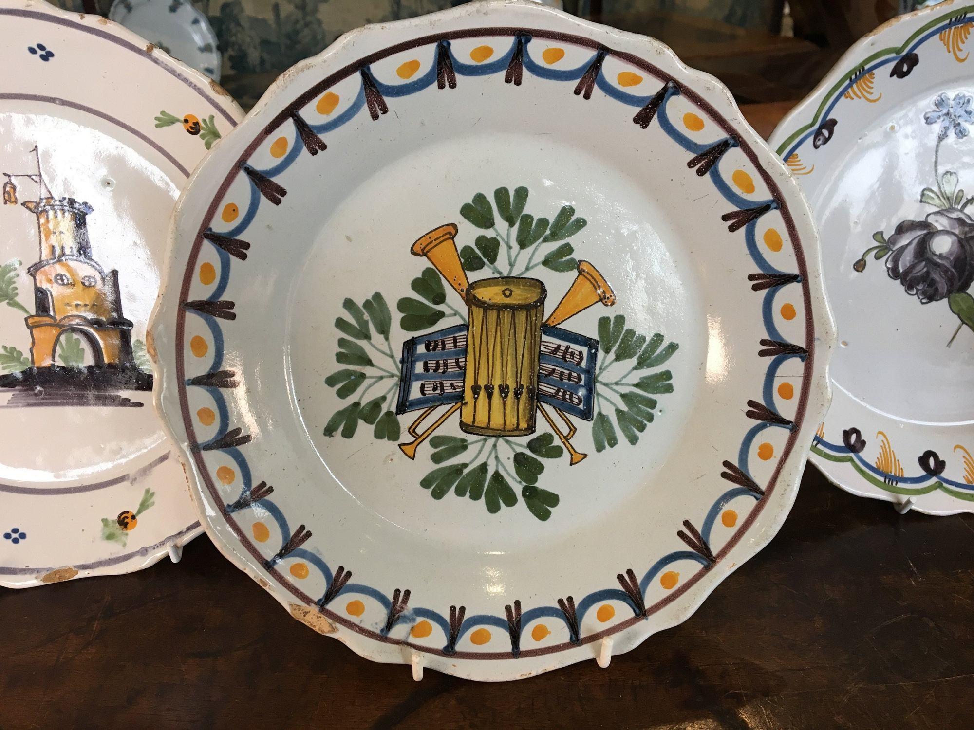 Set of four rare Nevers Faience plates in excellent condition.