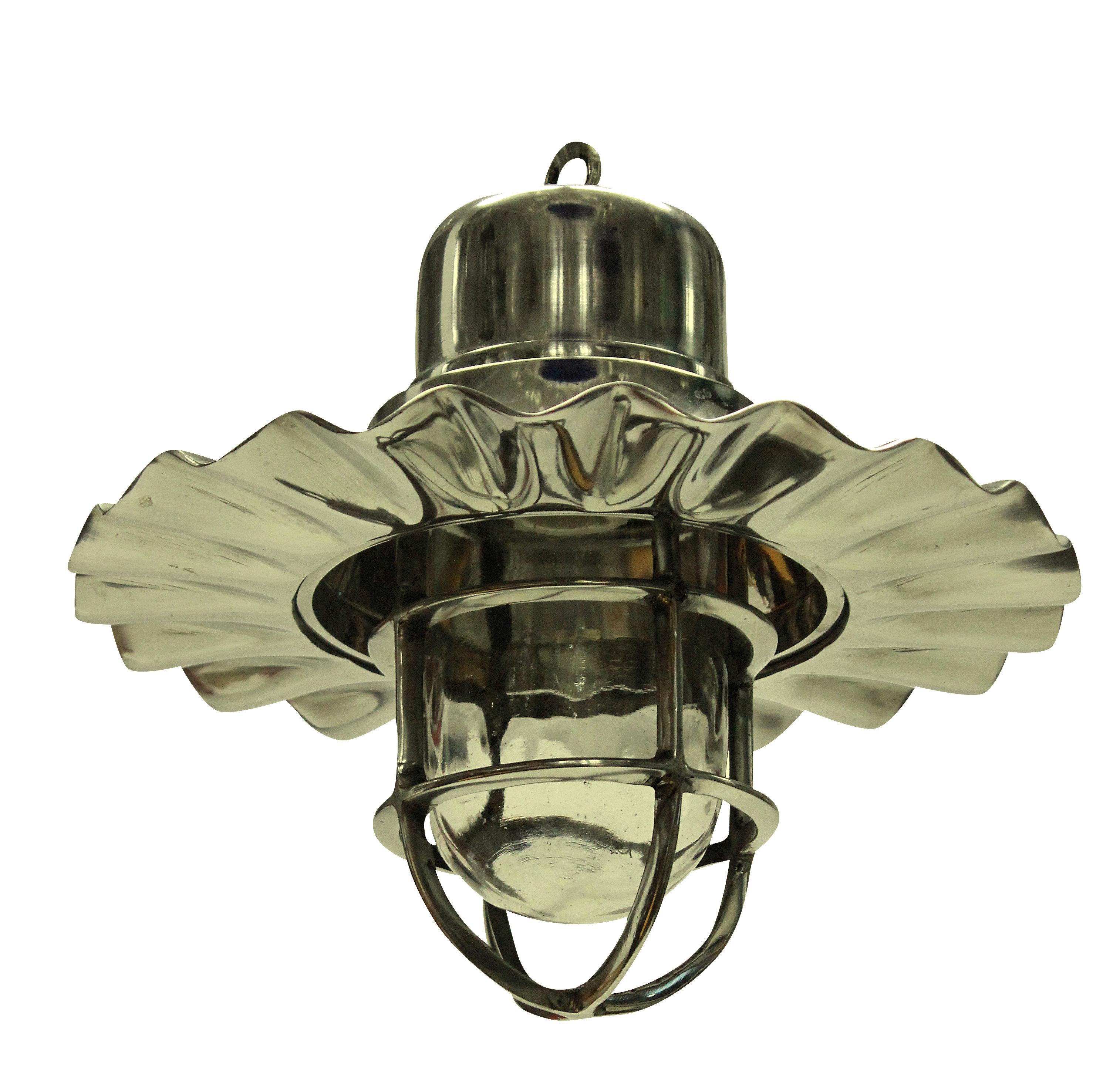 A set of four ship's hanging lights in nickel plate. With an interior glass case housing the light bulb.