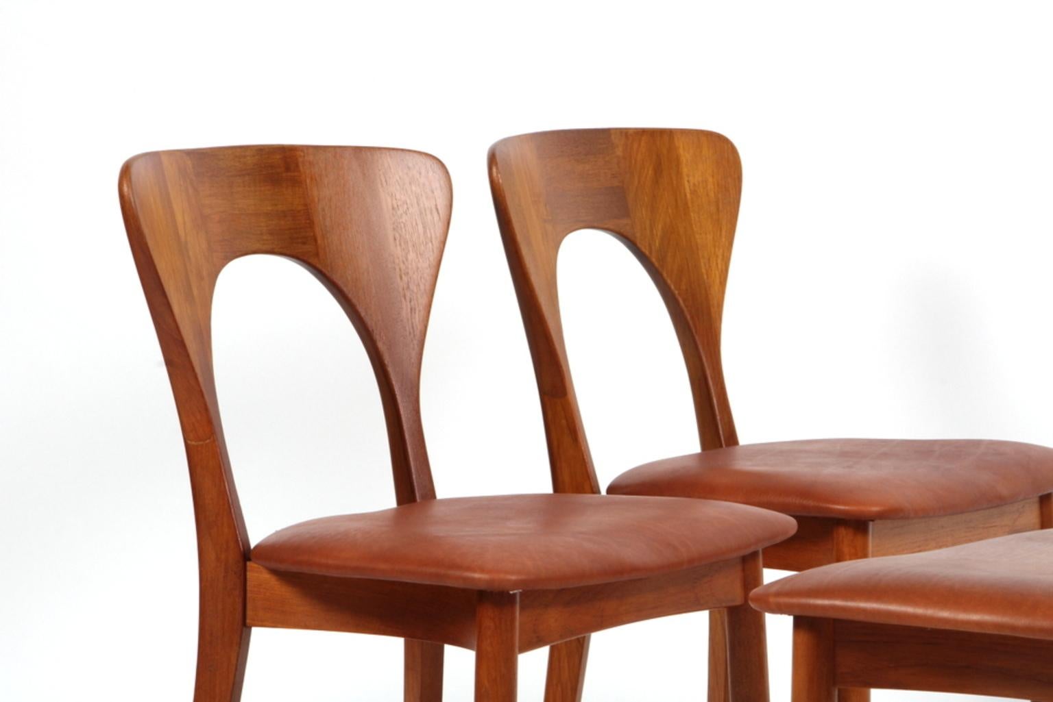 Set of four Niels Koefoed dining chairs in massive teak.

New upholstered with cognac aniline leather.

Made by Koefoeds Møbelfabrik.