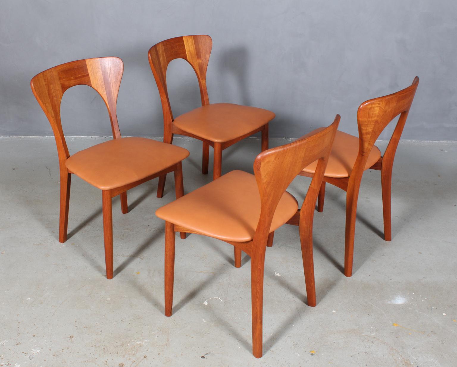 Set of four Niels Koefoed dining chairs in massive teak.

Model: Peter

New upholstered with cognac aniline leather.

Made by Koefoeds Møbelfabrik.