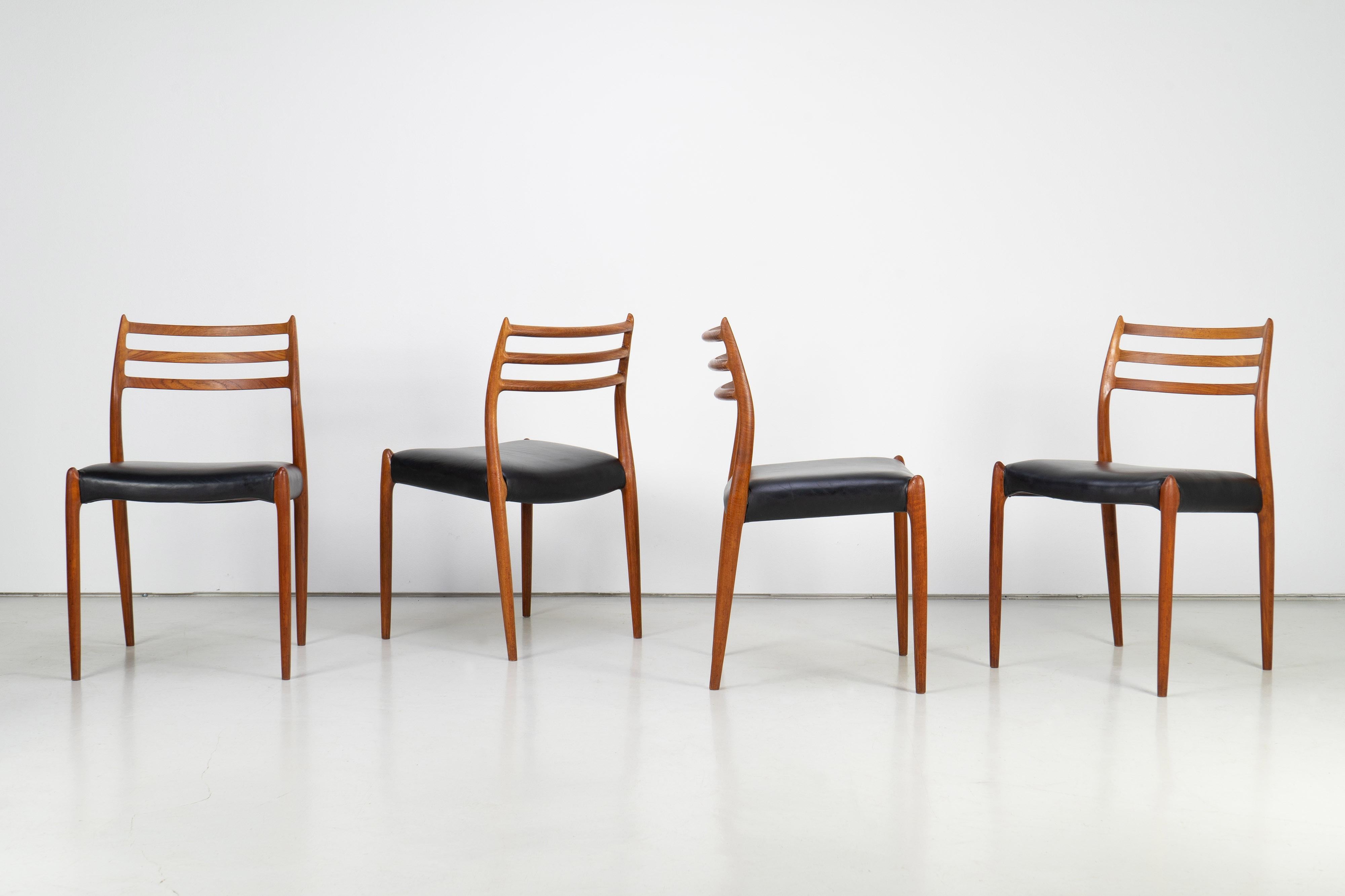 Set of four sophisticated dining chairs designed by Niels O. Møller. All chairs are of premium quality. The organic frames are made of real teakwood, upholstered with leather.