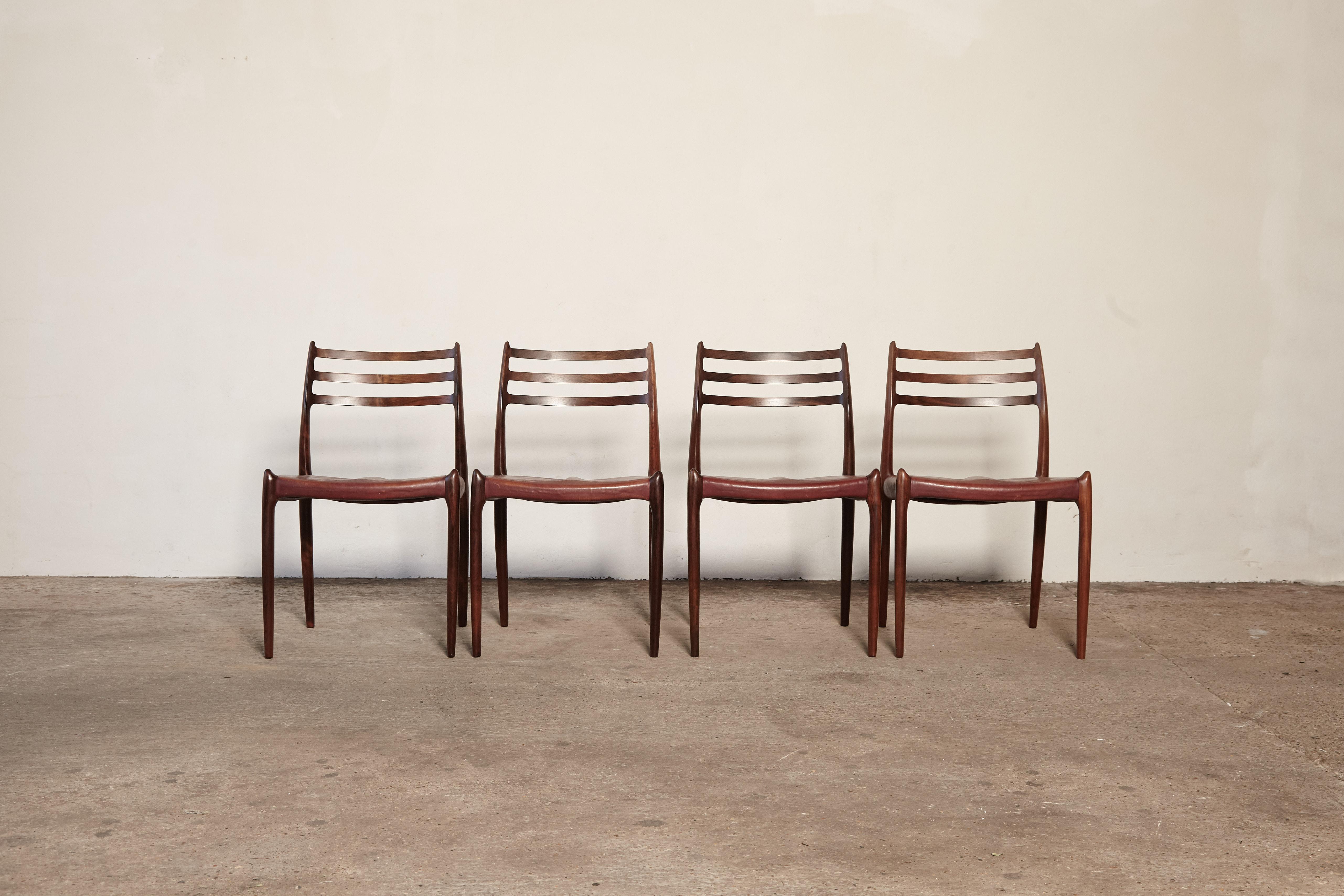 A beautiful set of four Niels O Møller model #78 rosewood dining chairs with original patinated leather seats, Denmark, 1960s. Produced by J.L. Moller Mobelfabrik in Denmark and stamped with makers mark. Excellent condition.
