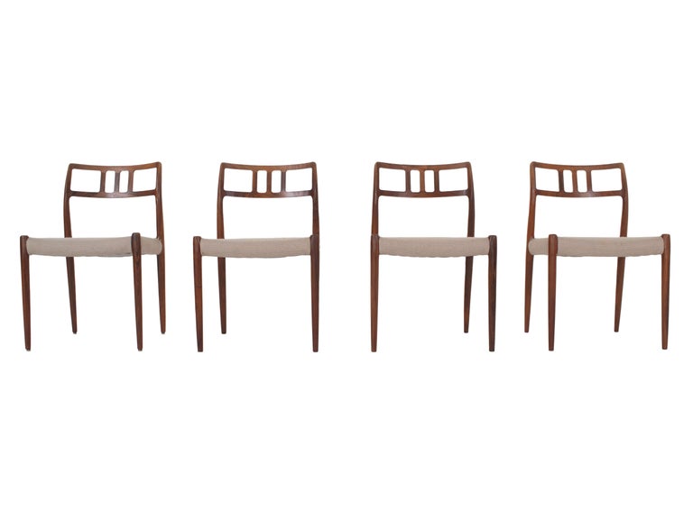 Set of Four Niels O. Møller Rosewood Dining Chairs Model 79, Denmark 1960s. These beautifully shaped chairs are manufactured by J.L. Møller Mobelfabrik. They are made of solid rosewood and have a great design for the backrest. The chairs are in very