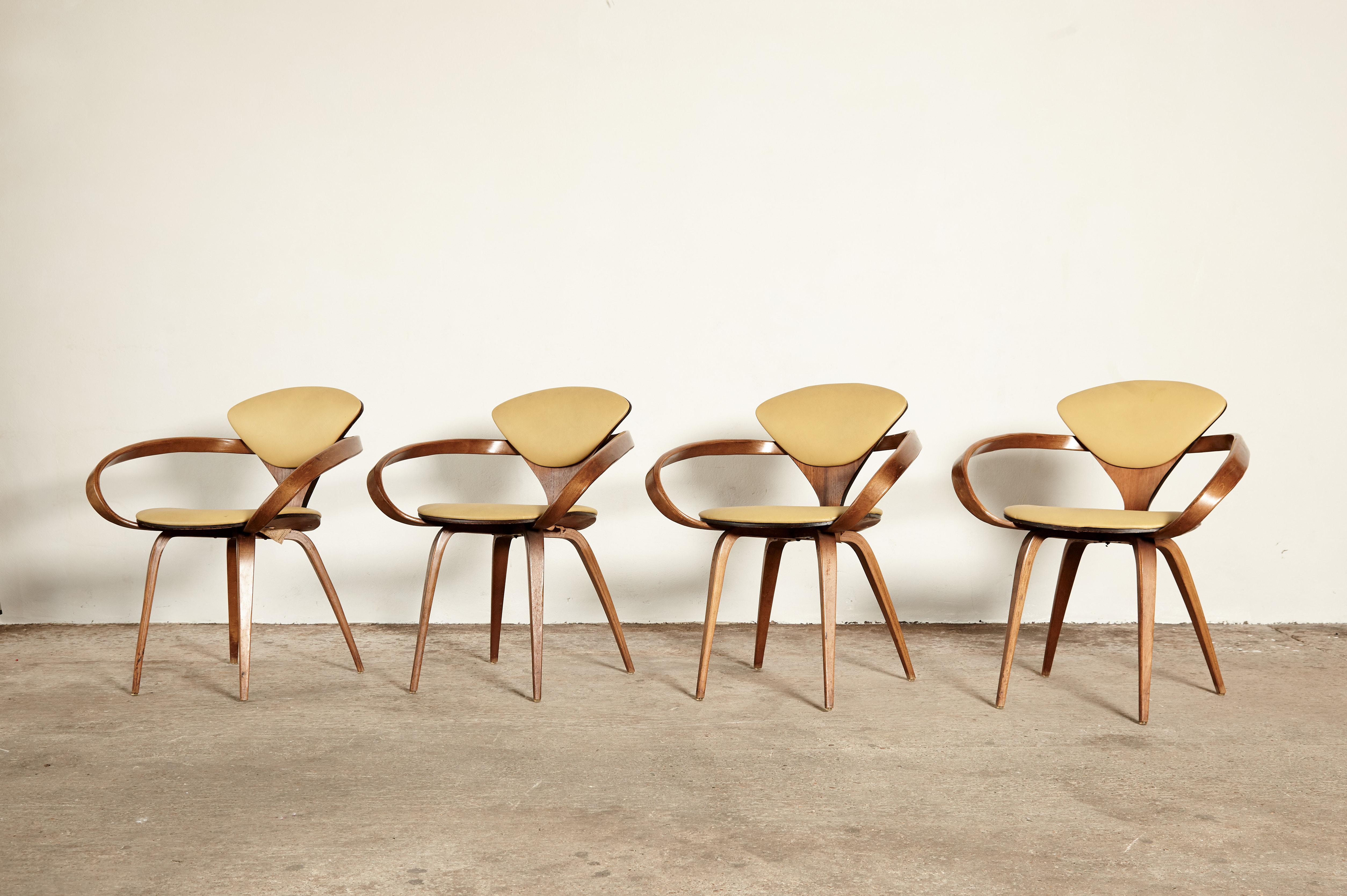 A set of four original Norman Cherner pretzel dining chairs, made by Plycraft, USA in the 1960s. Bentwood frames, original vinyl seats. In great original condition. Plycraft labels to the undersides. We offer a re-upholstery service if you would