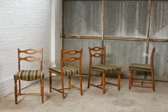 Set of four oak and wool dining room chairs by Henning Kjaernulf, 1960's