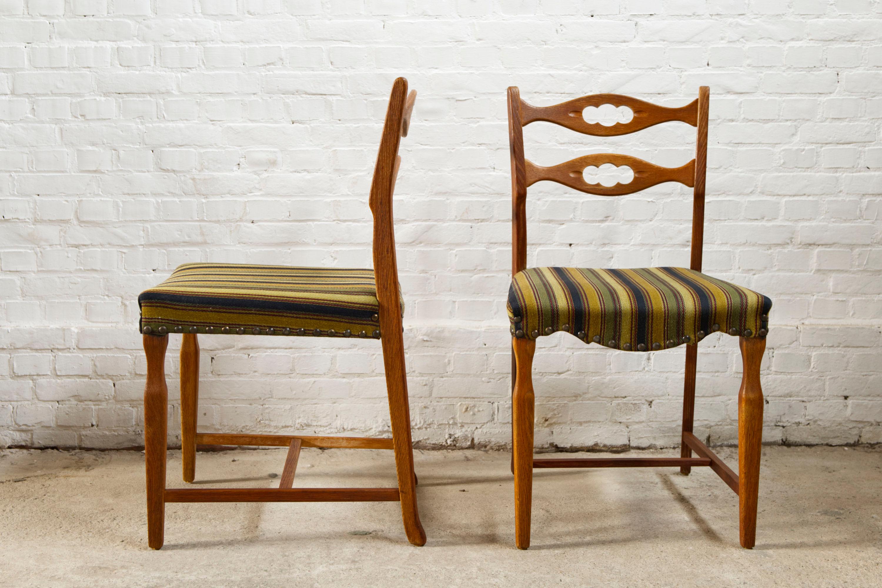 Scandinavian Modern Set of four oak and wool dining room chairs by Henning Kjaernulf, 1960's For Sale