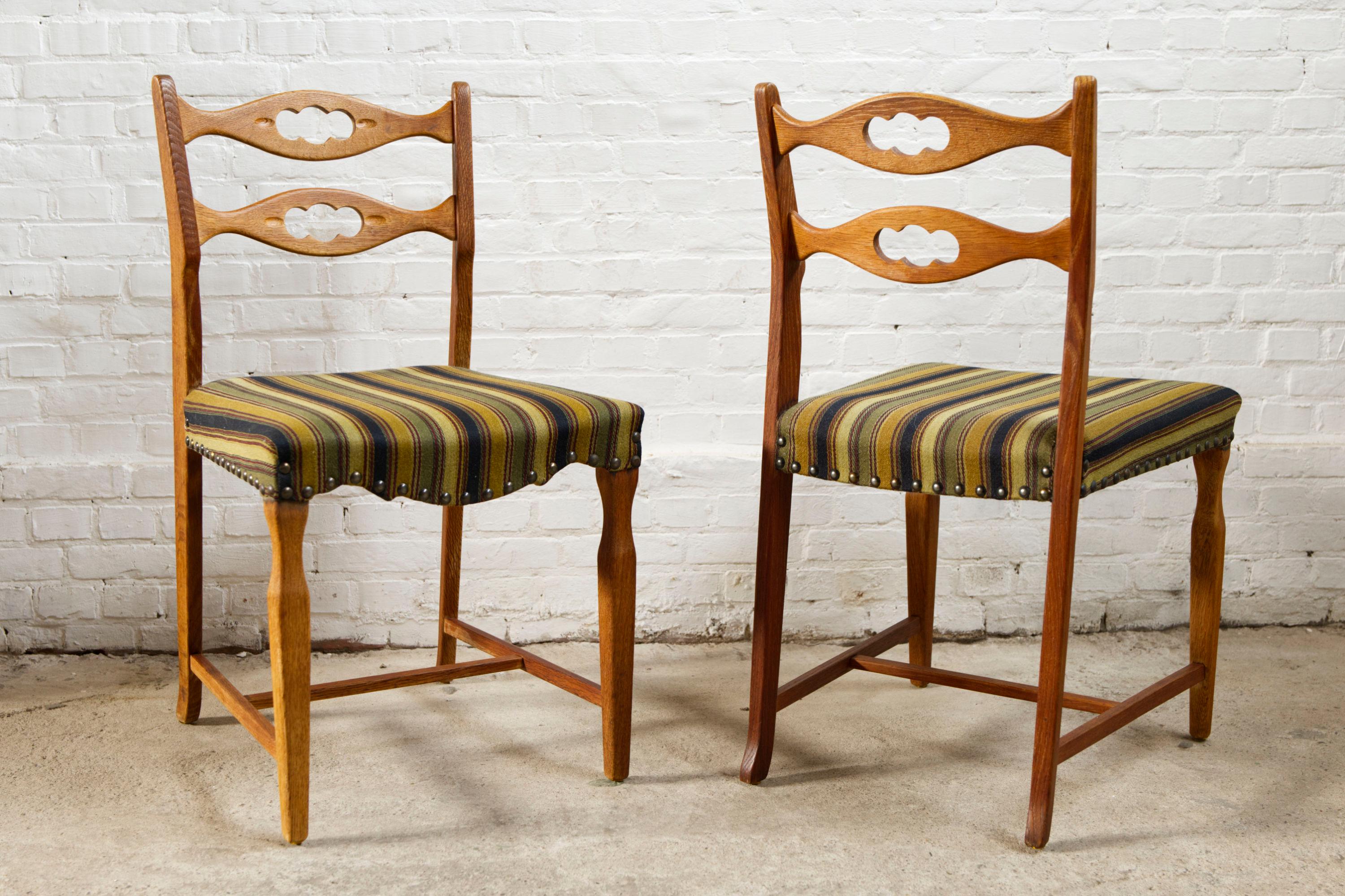 Danish Set of four oak and wool dining room chairs by Henning Kjaernulf, 1960's For Sale
