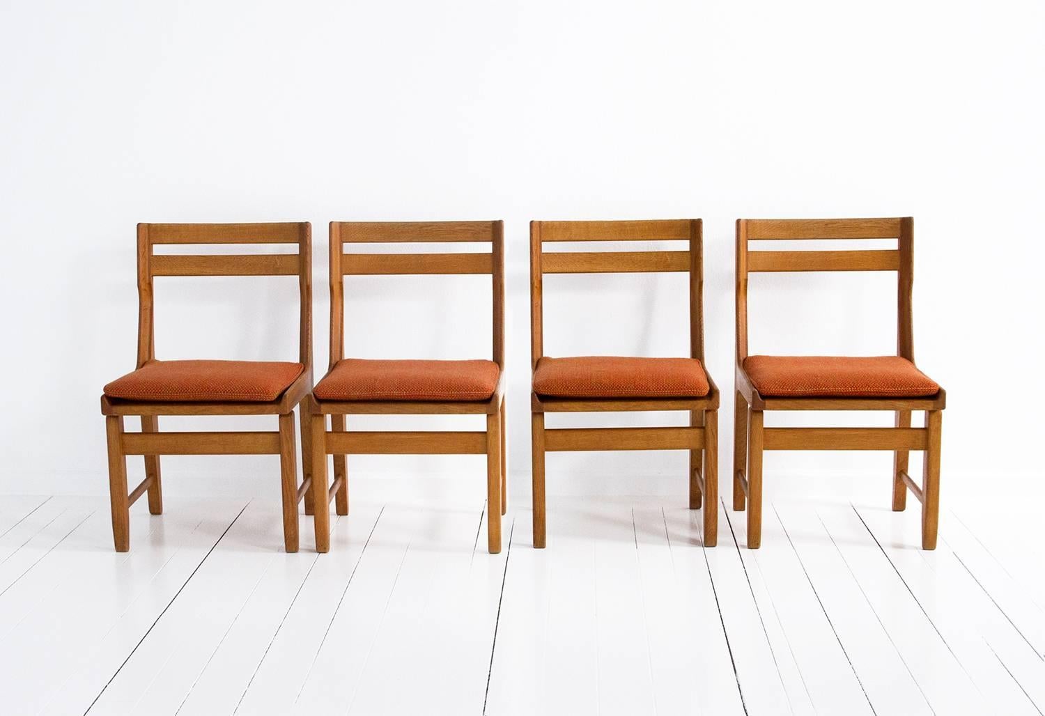 Set of four oak dining chairs by Guillerme and Chambron. 
Made of oakwood,
circa 1960, France.