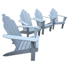 Juego de cuatro sillas de exterior Adirondack