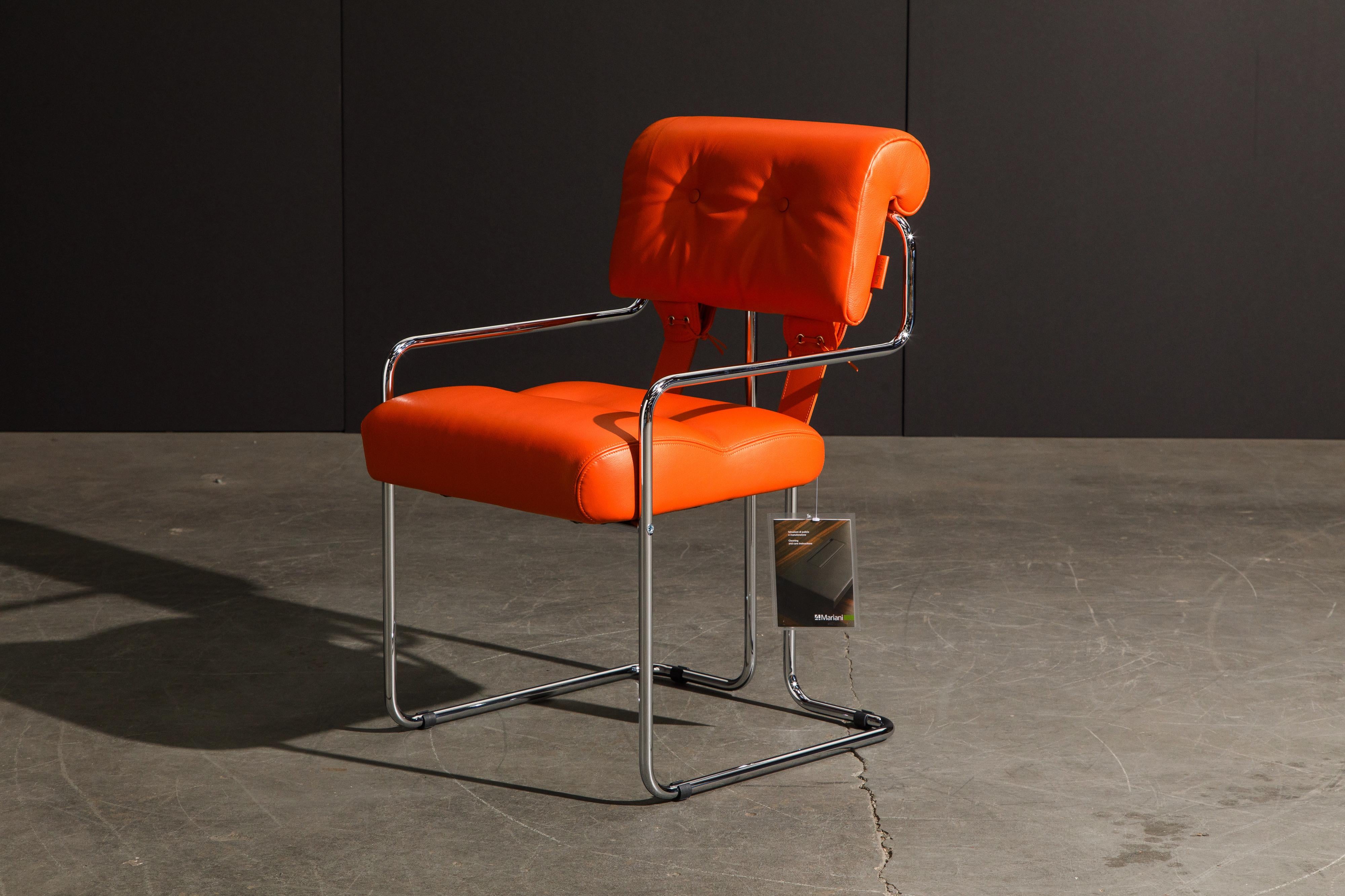 Currently, the most coveted dining chairs by interior designers are 'Tucroma' chairs by Guido Faleschini for i4 Mariani, and we have this incredible set of four (4) Tucroma armchairs in beautiful hot orange leather with polished chrome frames. The